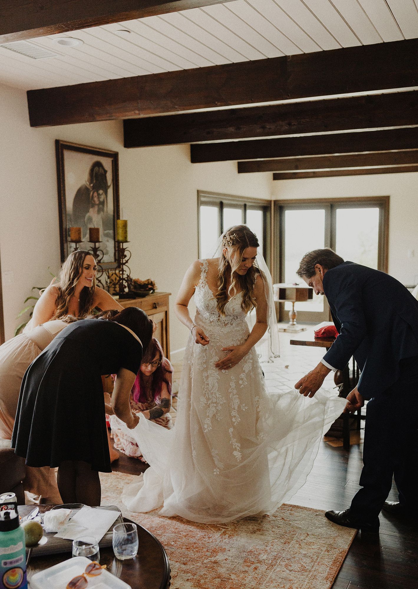 E Noelle Photography in-home wedding in Hidden Hills Los Angeles, bridal orange, candid of bride putting dress on