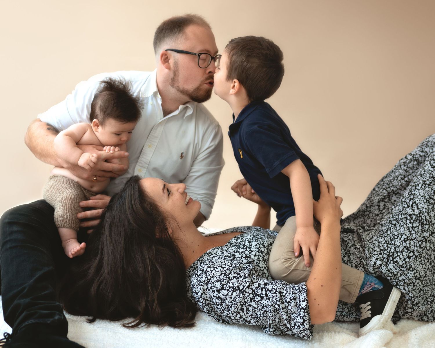Happy family lounging together and sharing an intimate moment