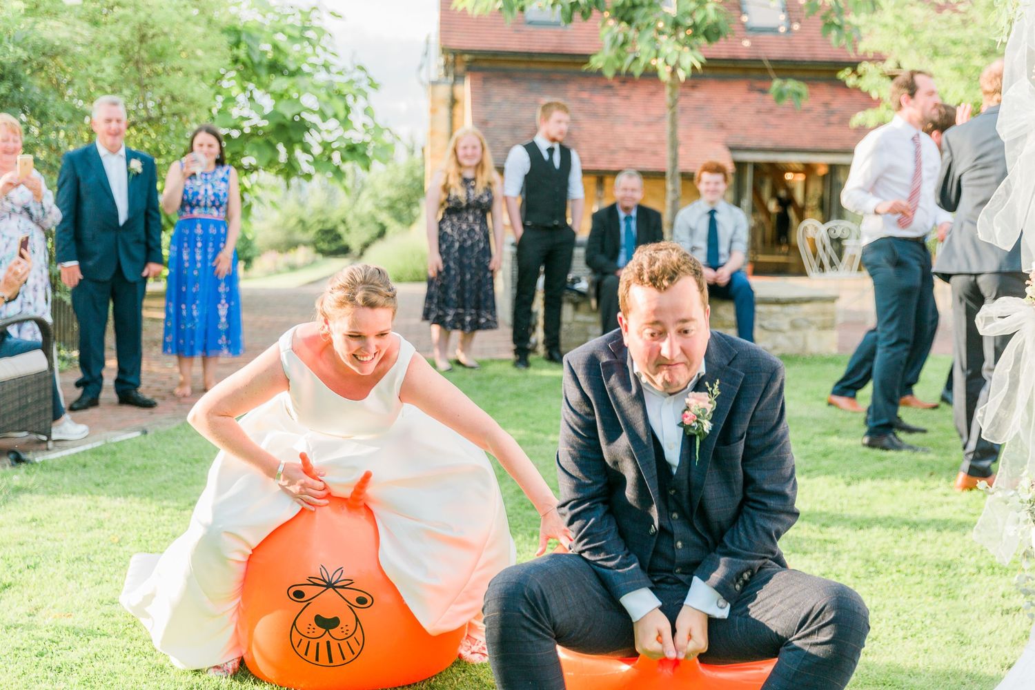 Hayley Elizabeth Wedding Photographer Deer Park Hall Cotswolds Worcestershire space hopper bride and groom action photo