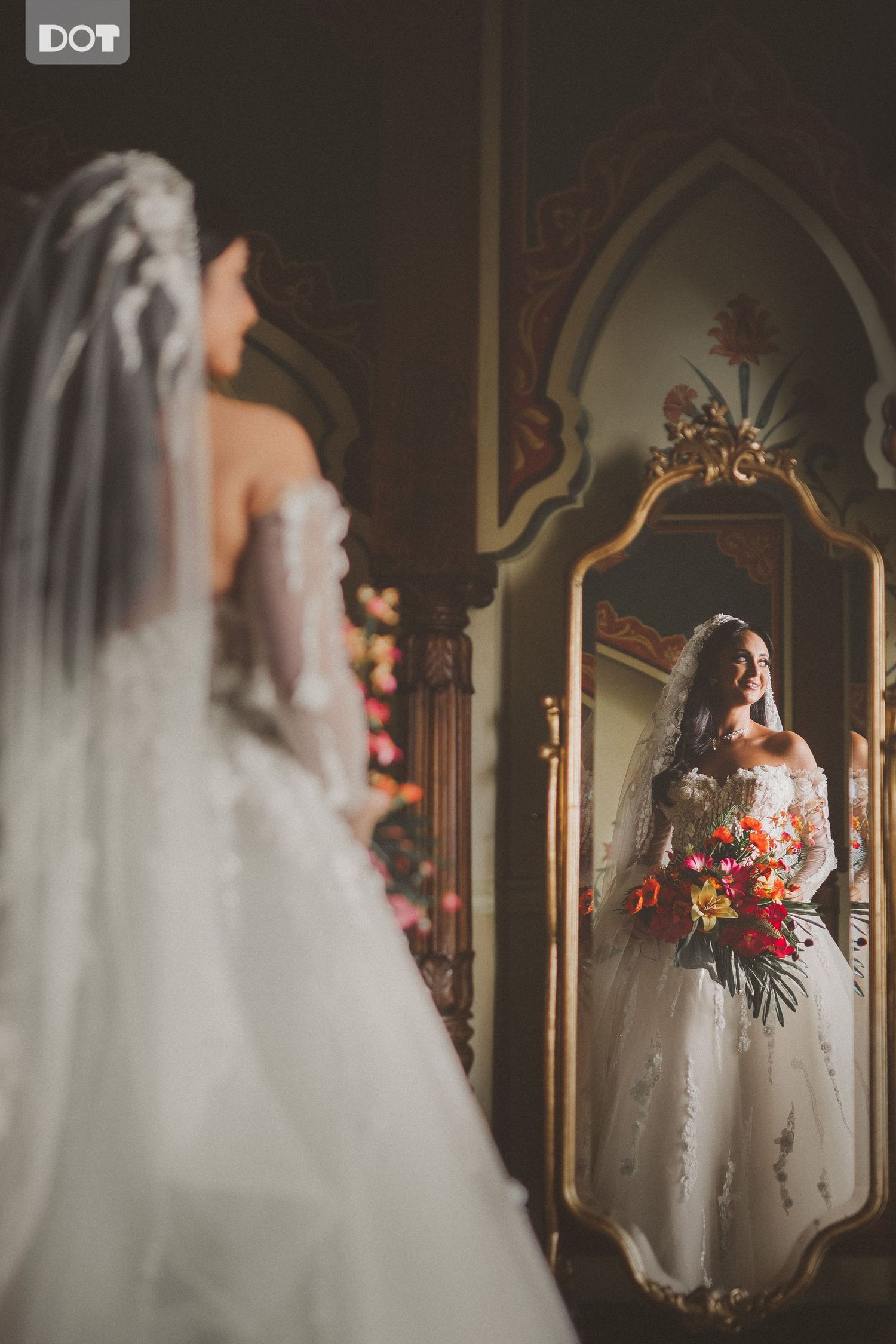 Elegant bridal portraits captured in a dimly lit church interior with ornate mirrors and architectural details.