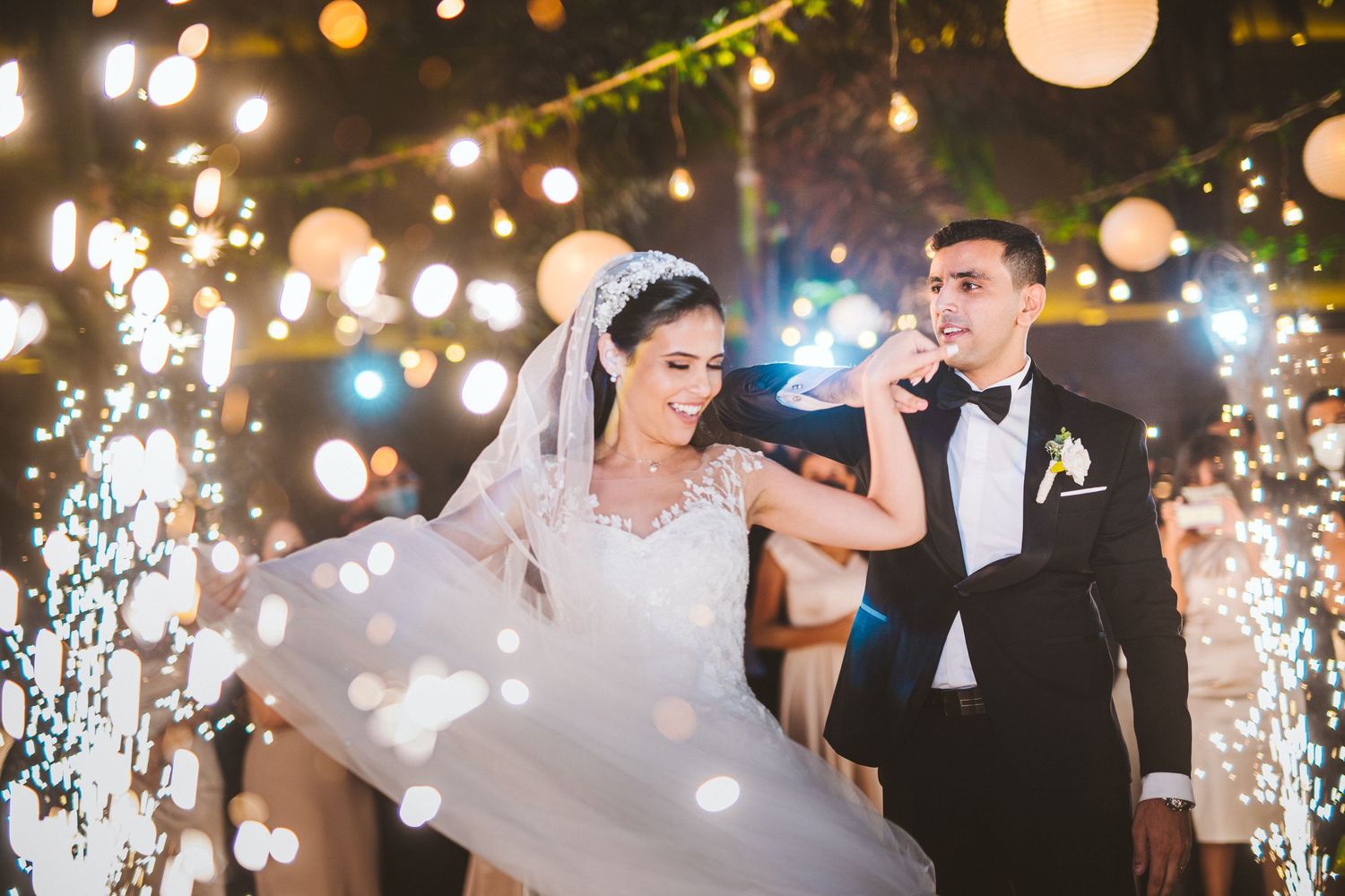 Wedding reception dance floor with twinkling lights and lanterns creating magical ambiance.