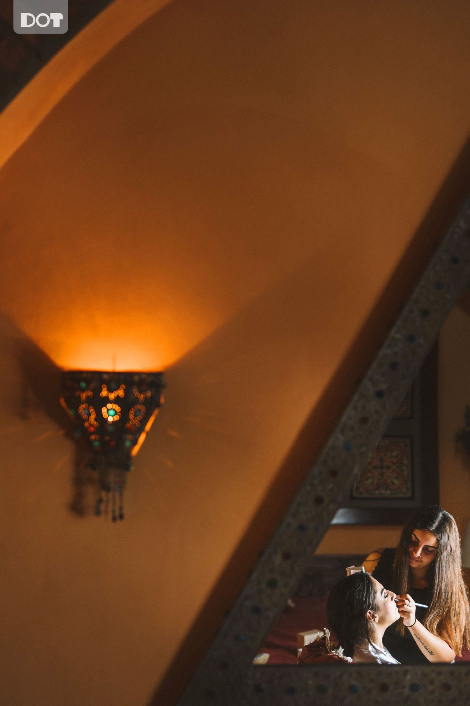 Warm amber-lit indoor photos creating intimate romantic atmosphere.