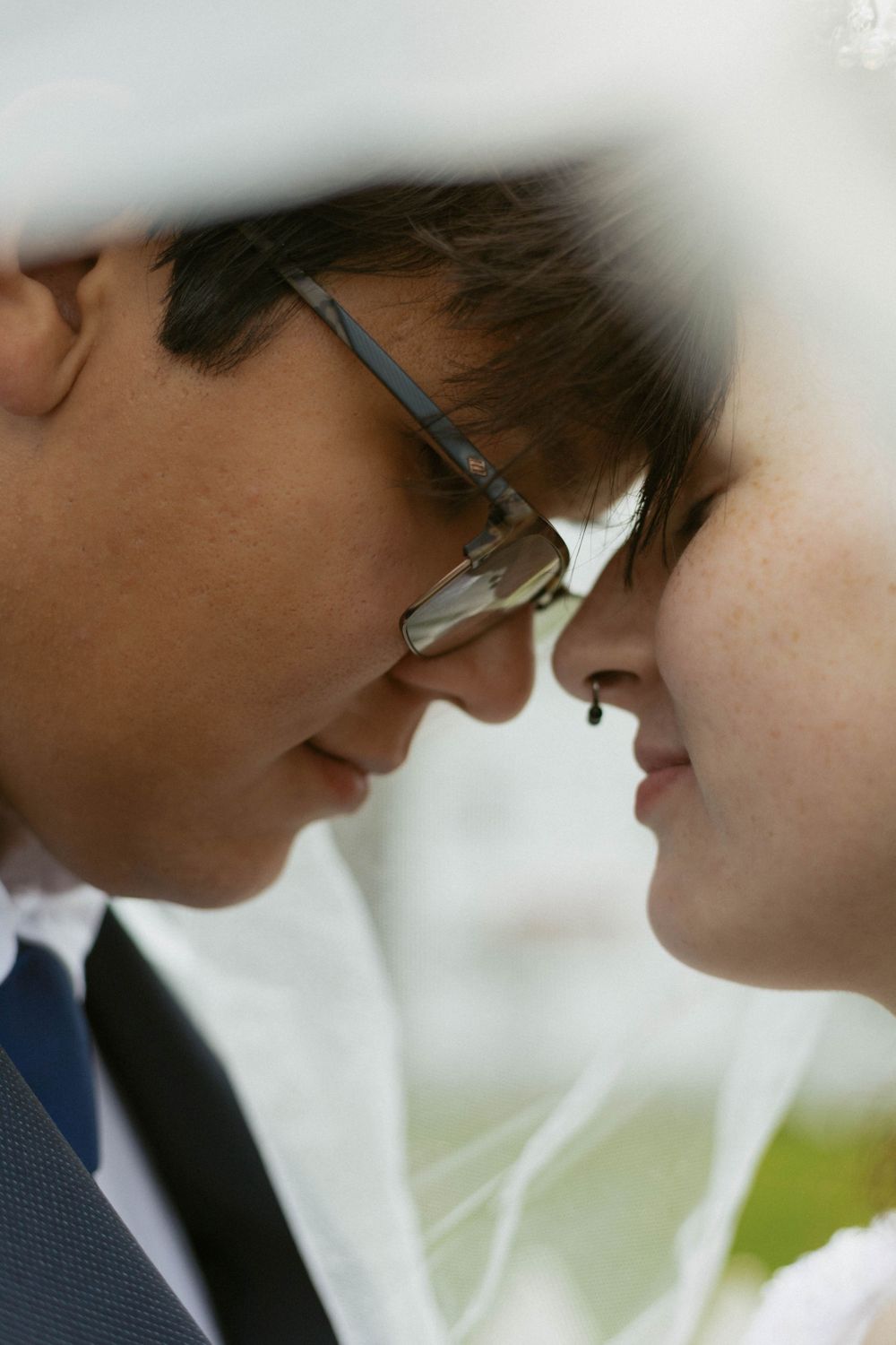 A romantic close-up moment between a couple on their wedding day.