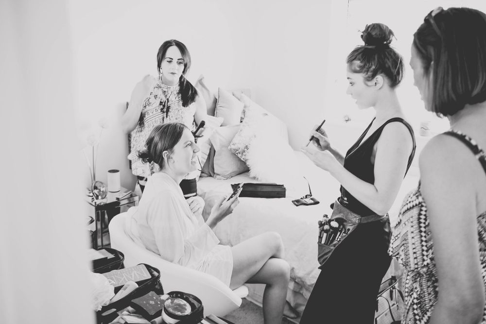 Black and white image of group sitting together during preparation session.