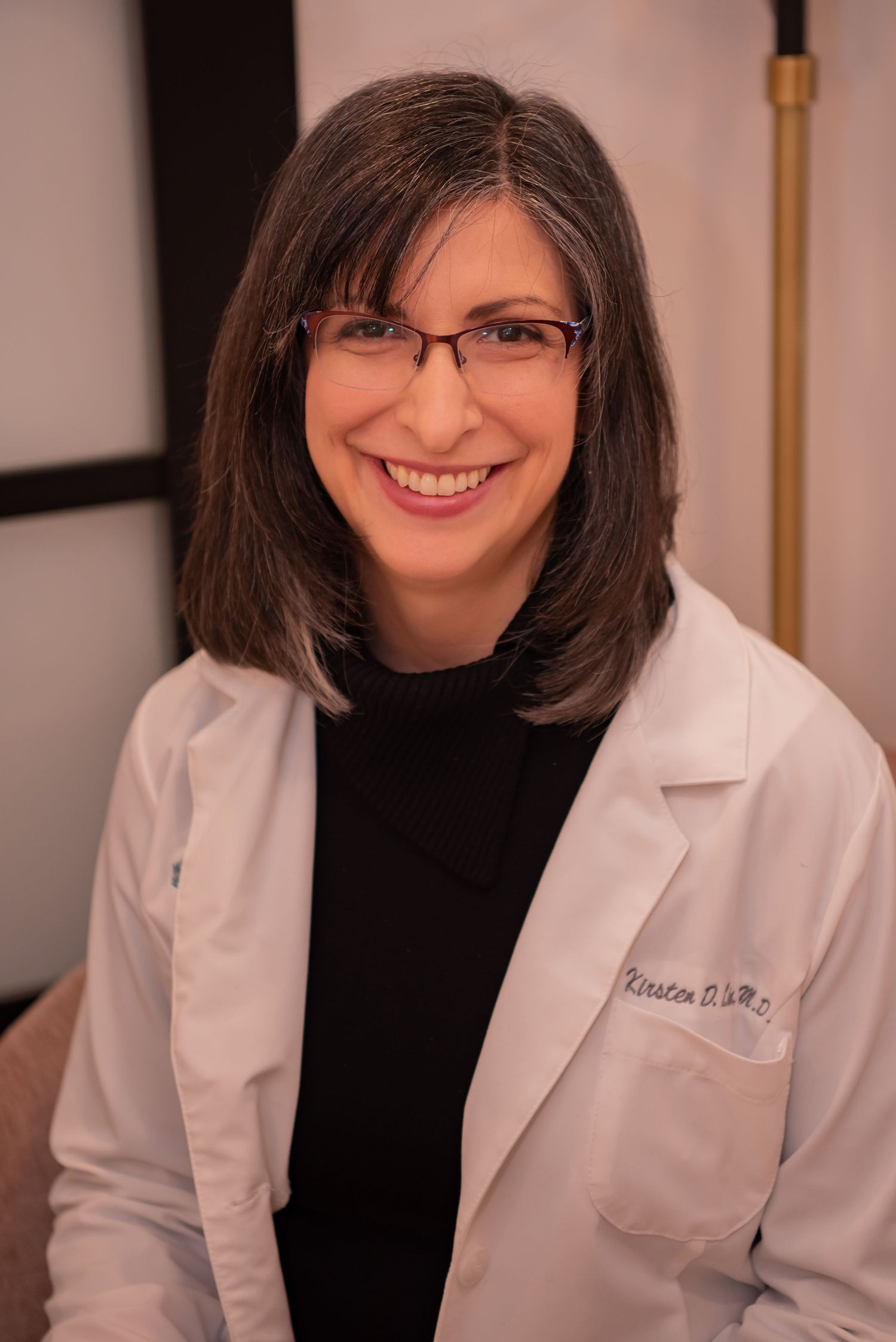 woman physician in white coat kirsten lin