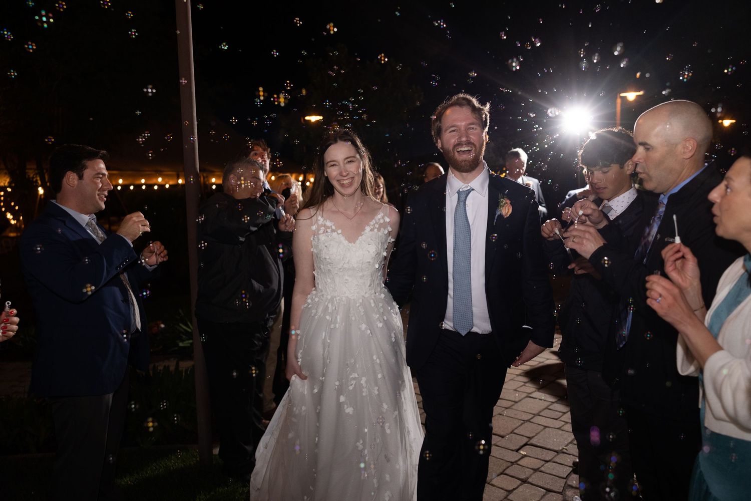 Bride and Groom exiting wedding with bubbles in Chico, California Wedding at Iron Gate Inn.
