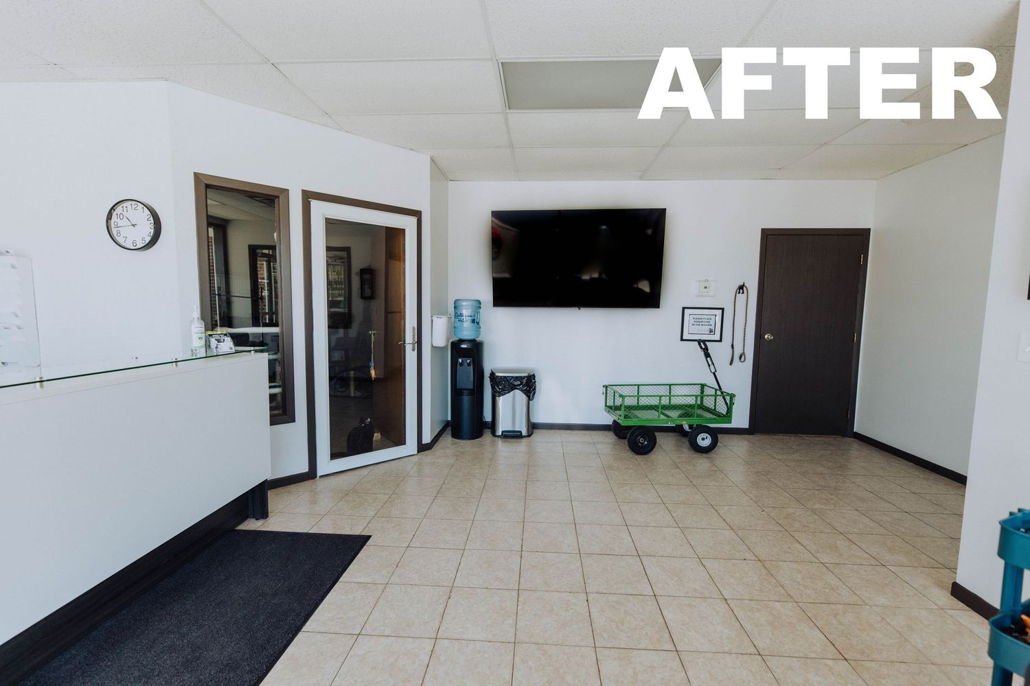 Clean, minimalist office space with white walls and tiled flooring after organization.