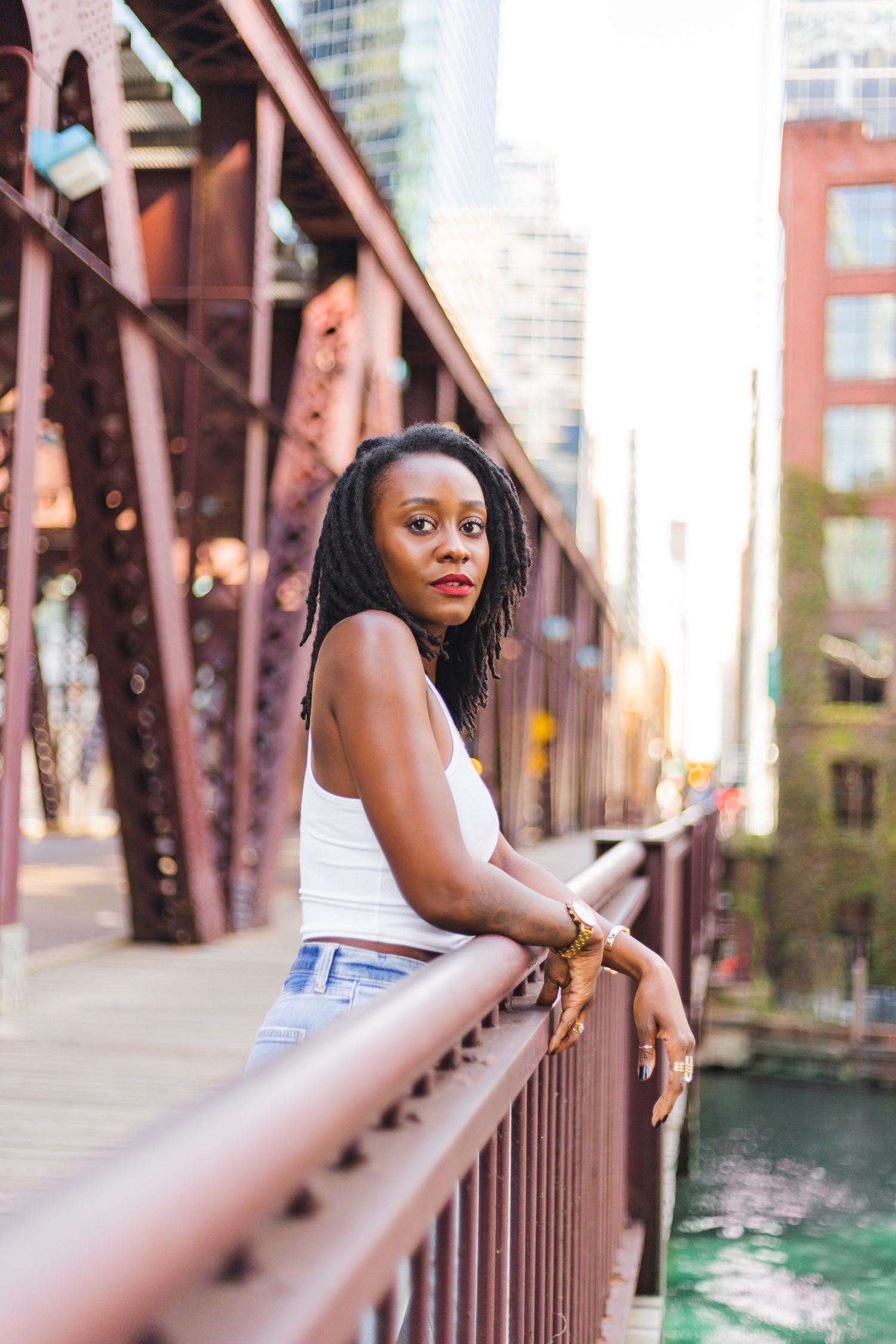 Black woman with locs on chicago bridge by CLW Photography