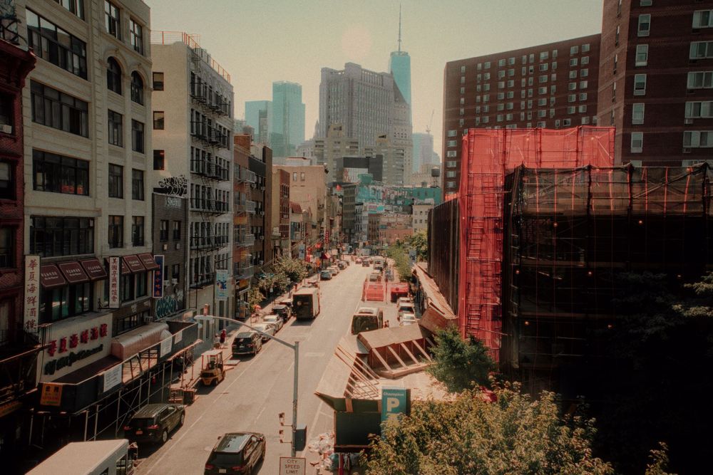Retro-toned cityscape view of New York street with buildings and traffic.