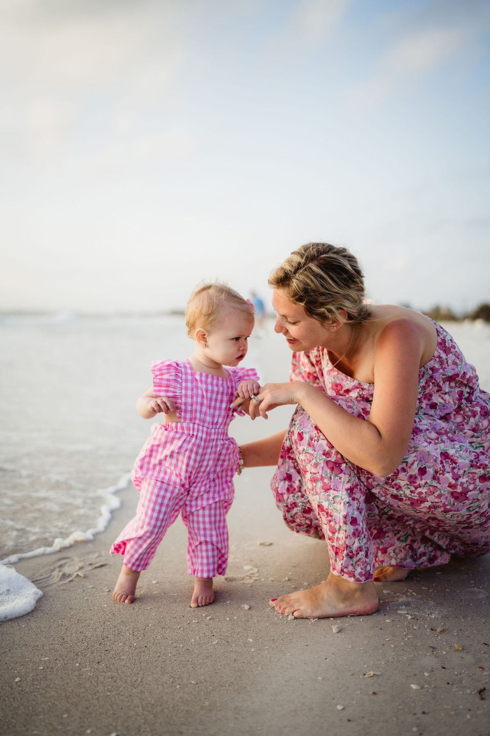 A sweet moment shared on the beach during golden hour.