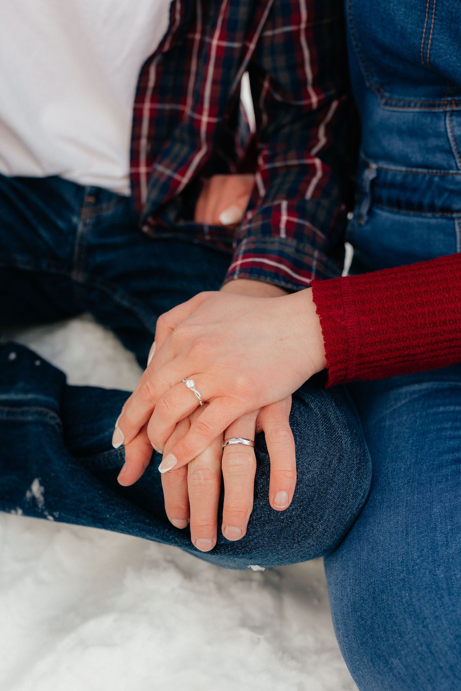Engaged Couple Holding hands showing engagement ring