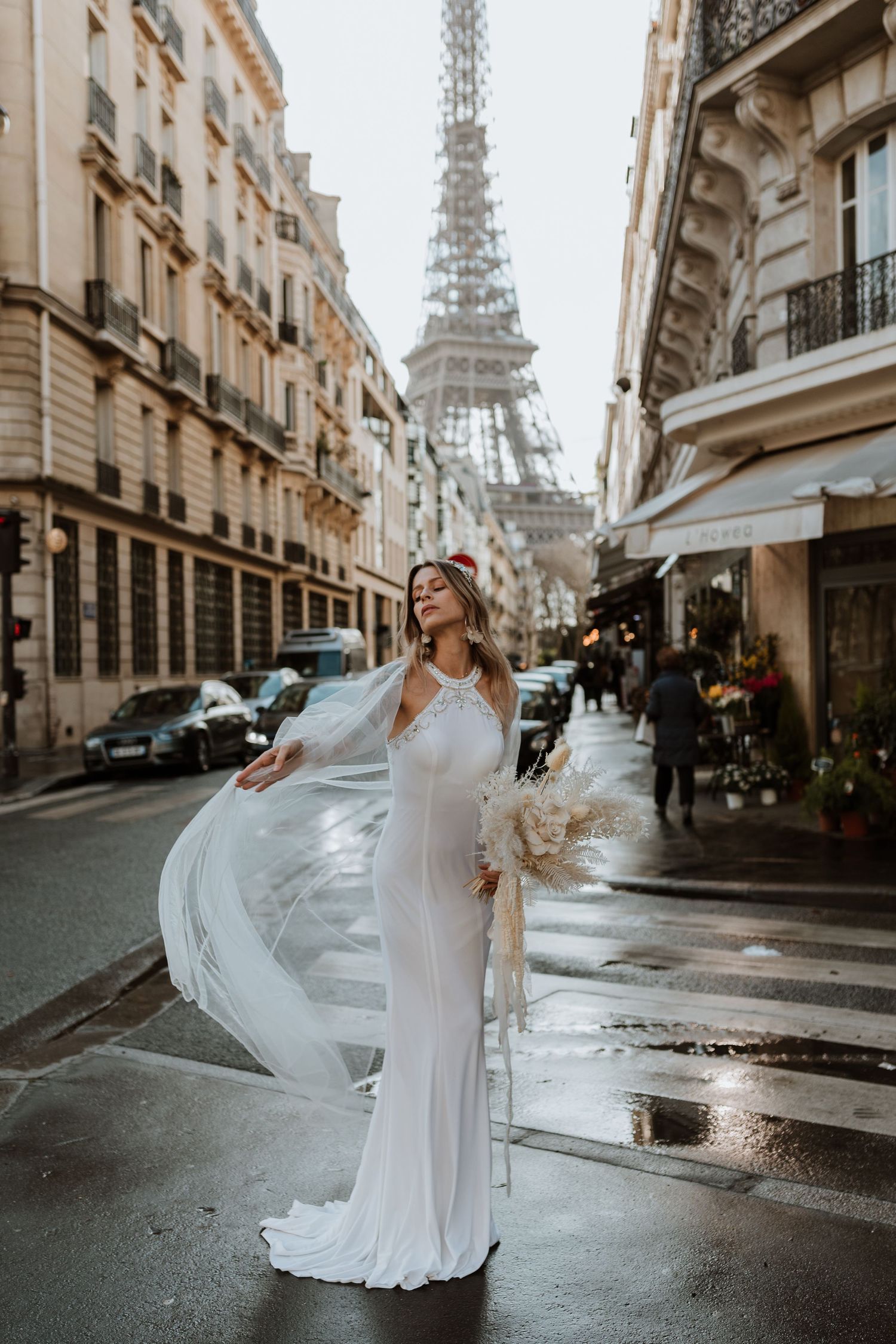 Bride taking a moment with Eiffel tower in the backdrop
