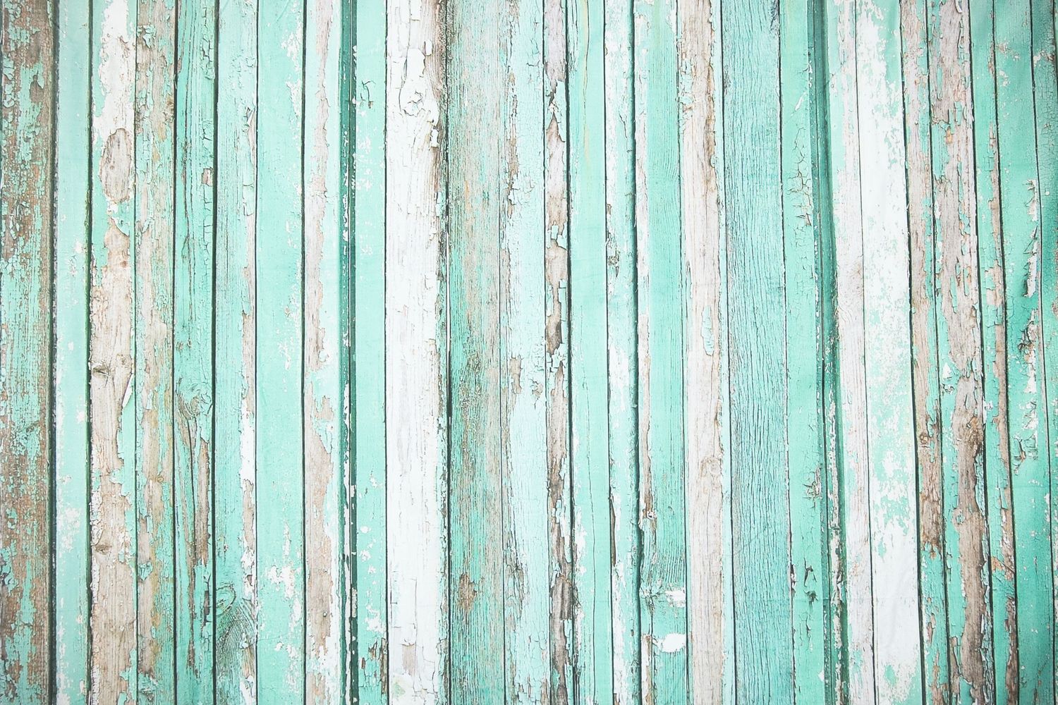 Weathered wood planks painted in shabby chic mint green and white stripes.