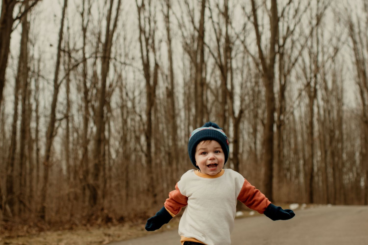 Toddler running in the woods