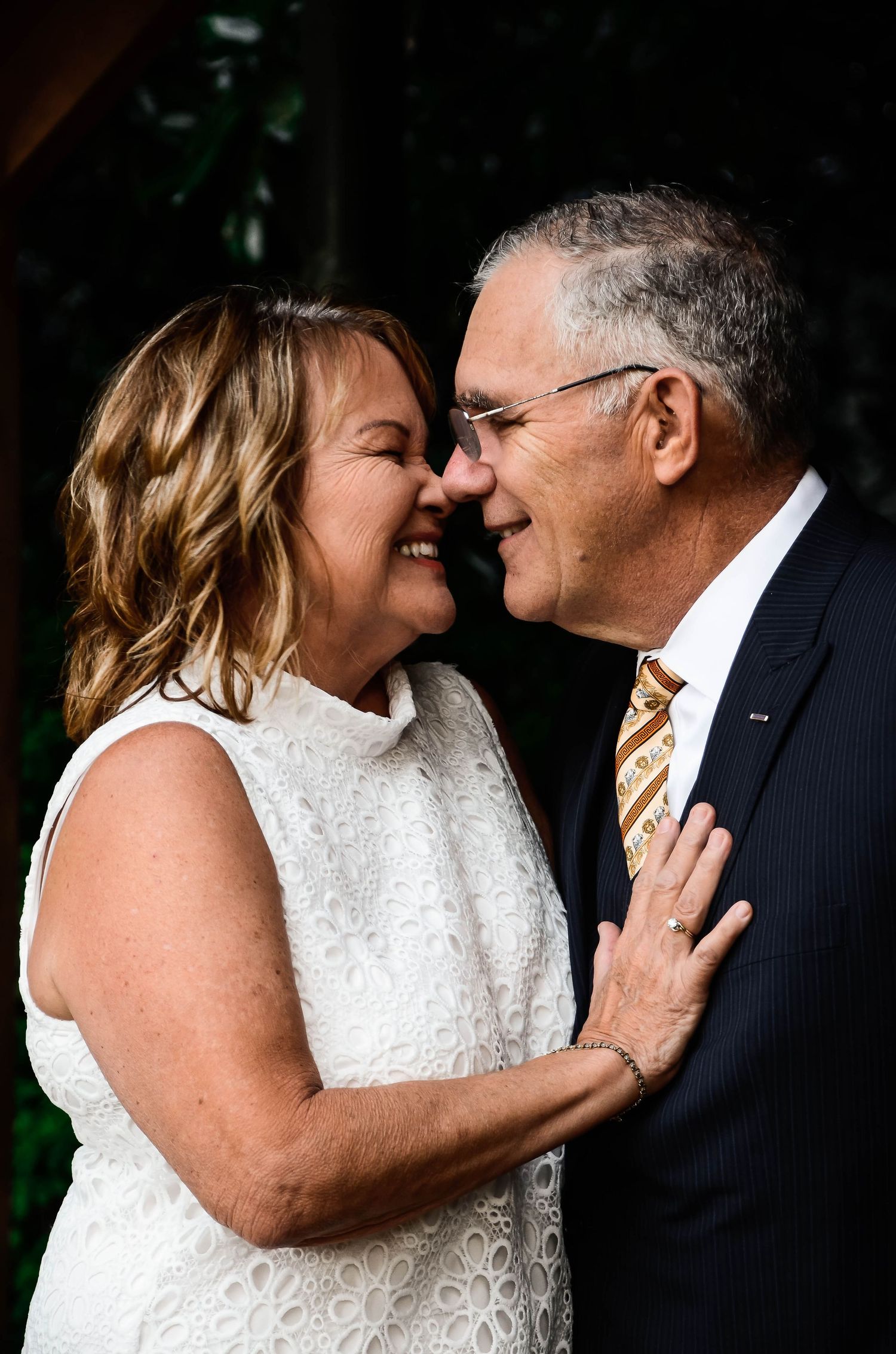 Loving couple sharing a tender moment, captured in a natural and romantic setting during a photo session