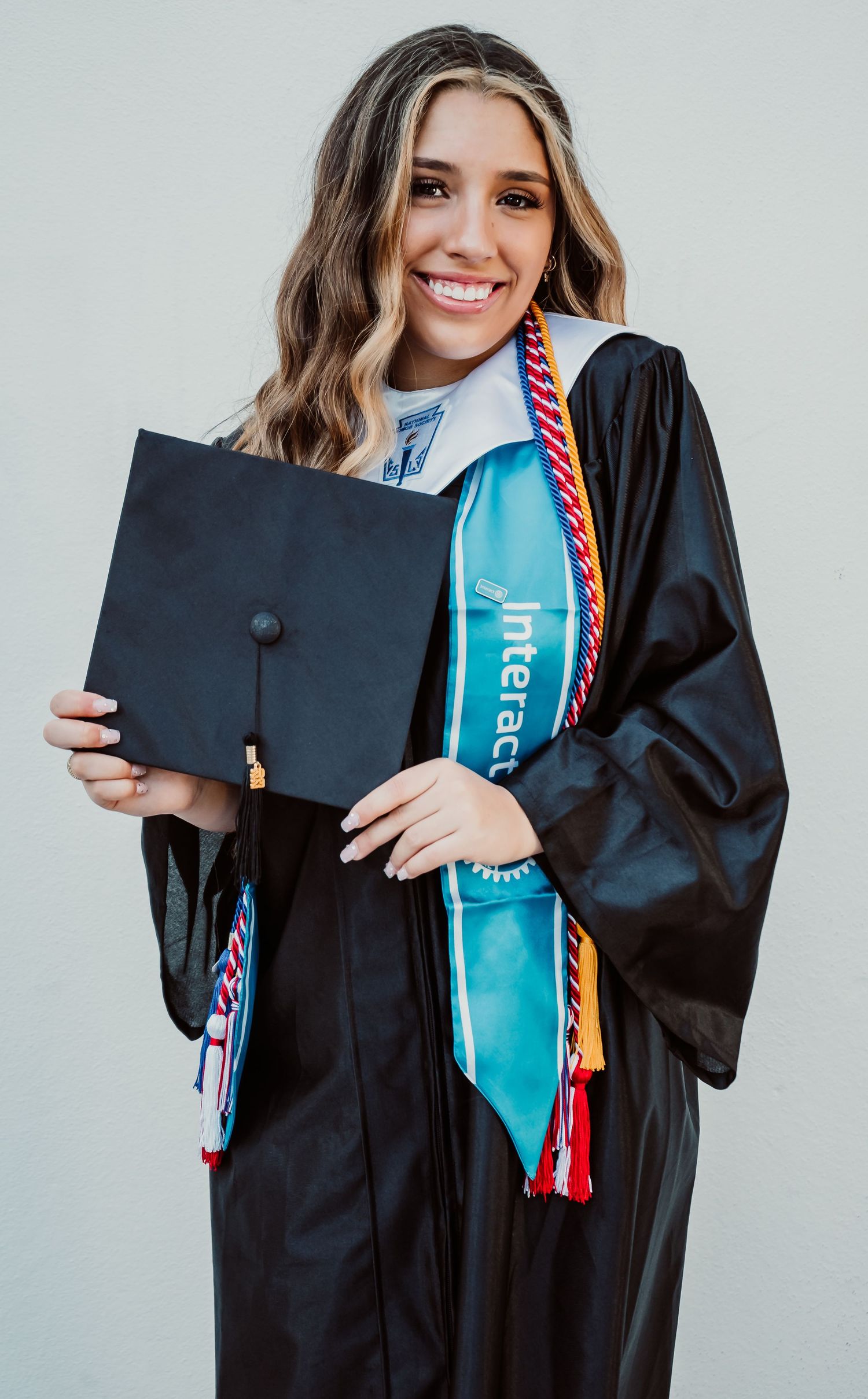 Outdoor Senior Portrait Session Downtown St. Pete, FL; Senior photos, teen posing with cap and gown