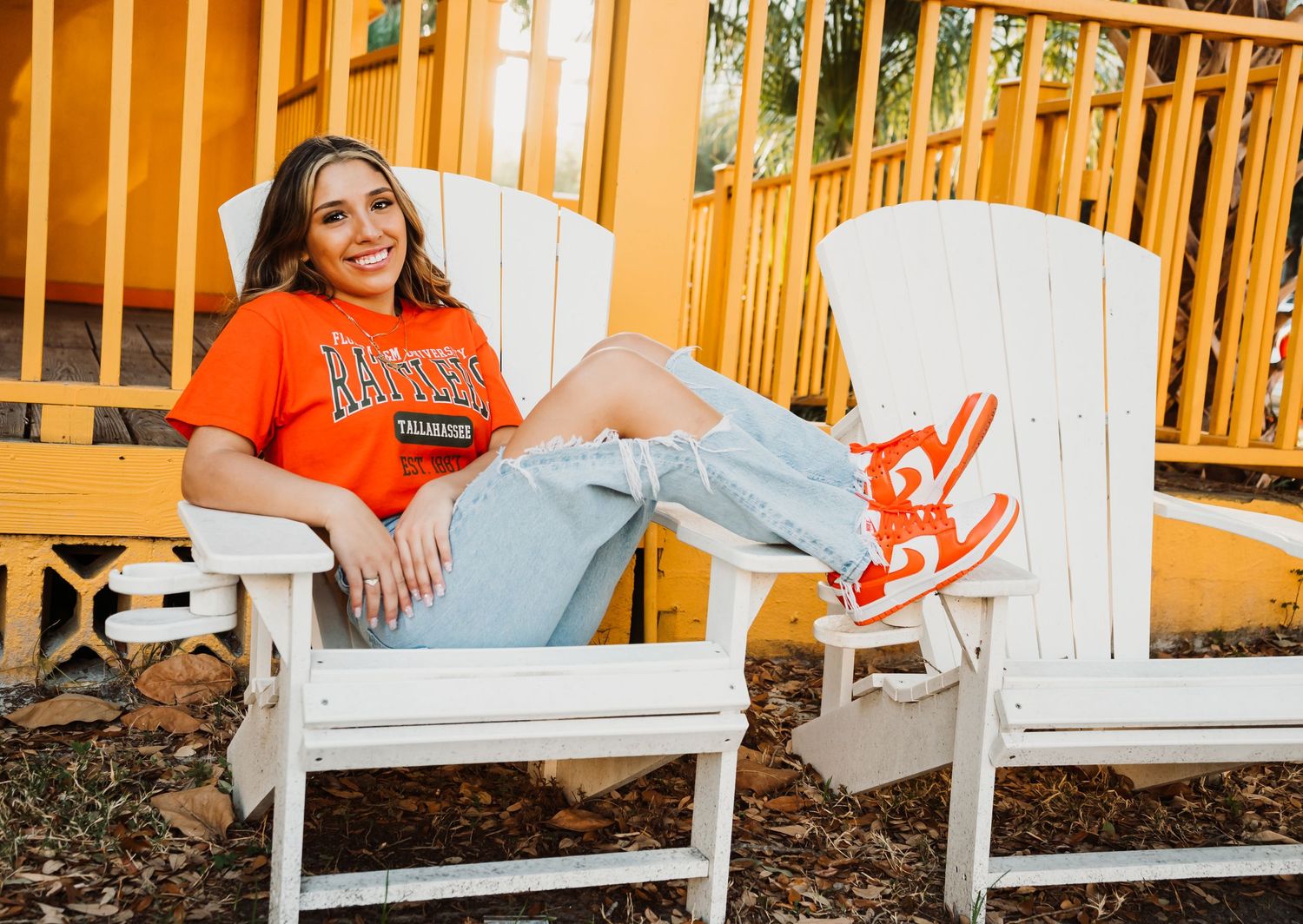 Outdoor Senior Portrait Session Downtown St. Pete, FL; Senior photos, teen lounging in Adirondack chair