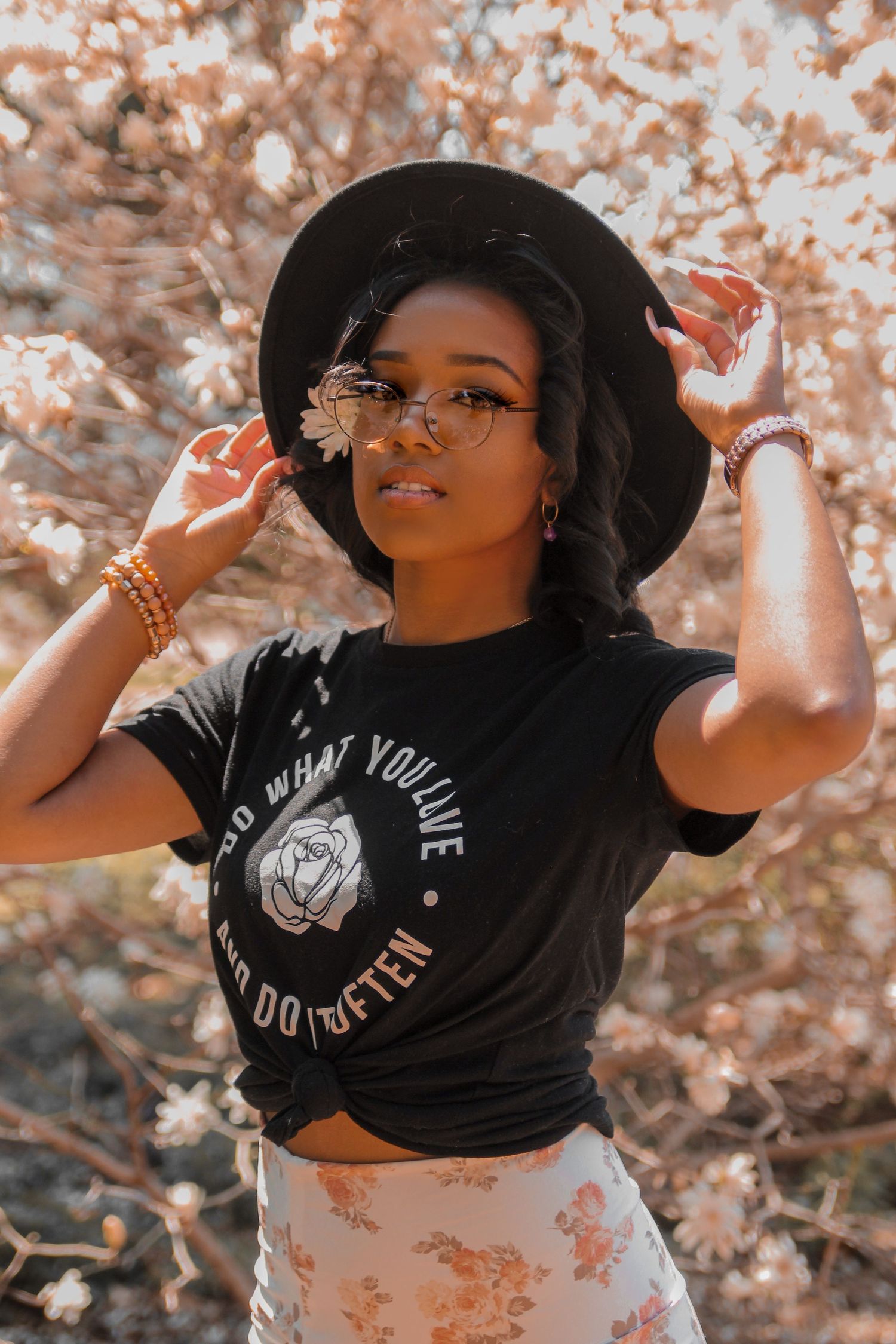 Woman with black hate wearing hipster 90's grunge aesthetic
