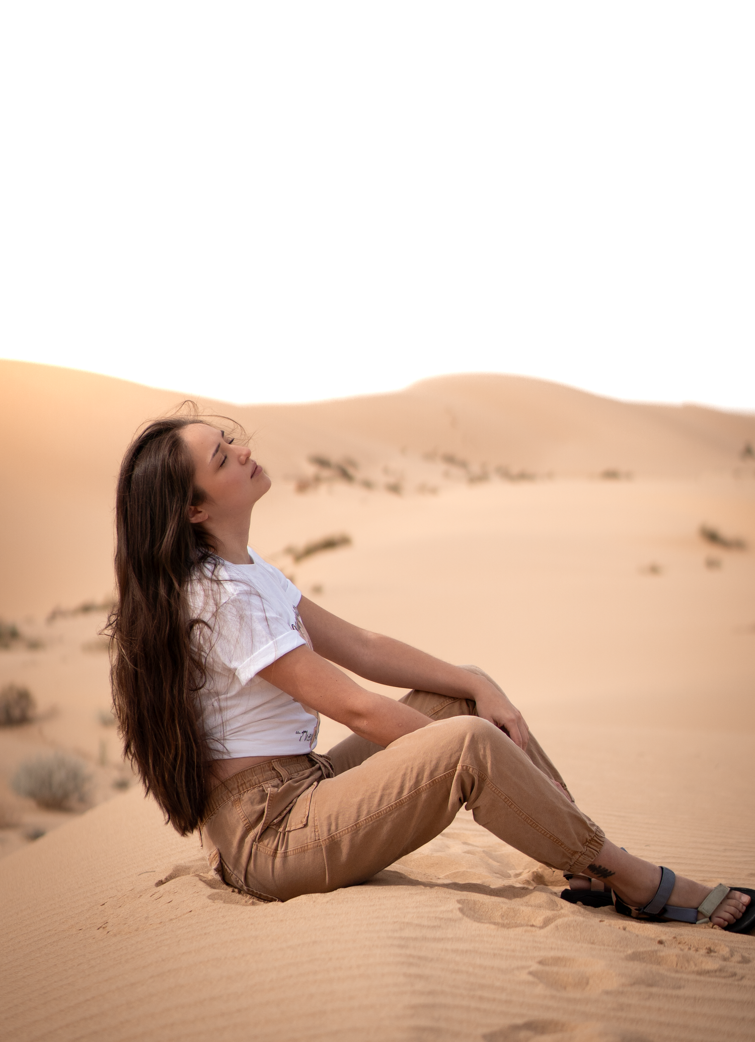Woman posing in the imperial sand dunes in California