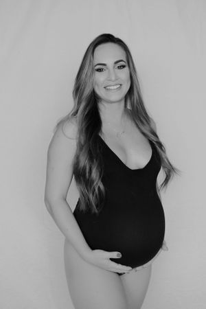 Black and white boudoir photography session with artistic poses.