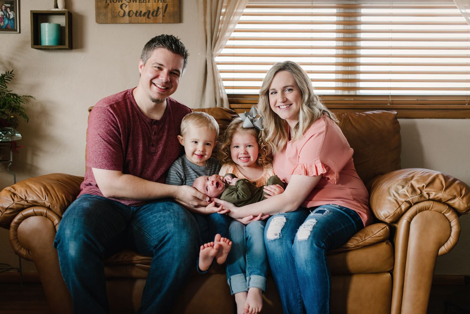 In-home lifestyle newborn family photo session by Wichita photographer