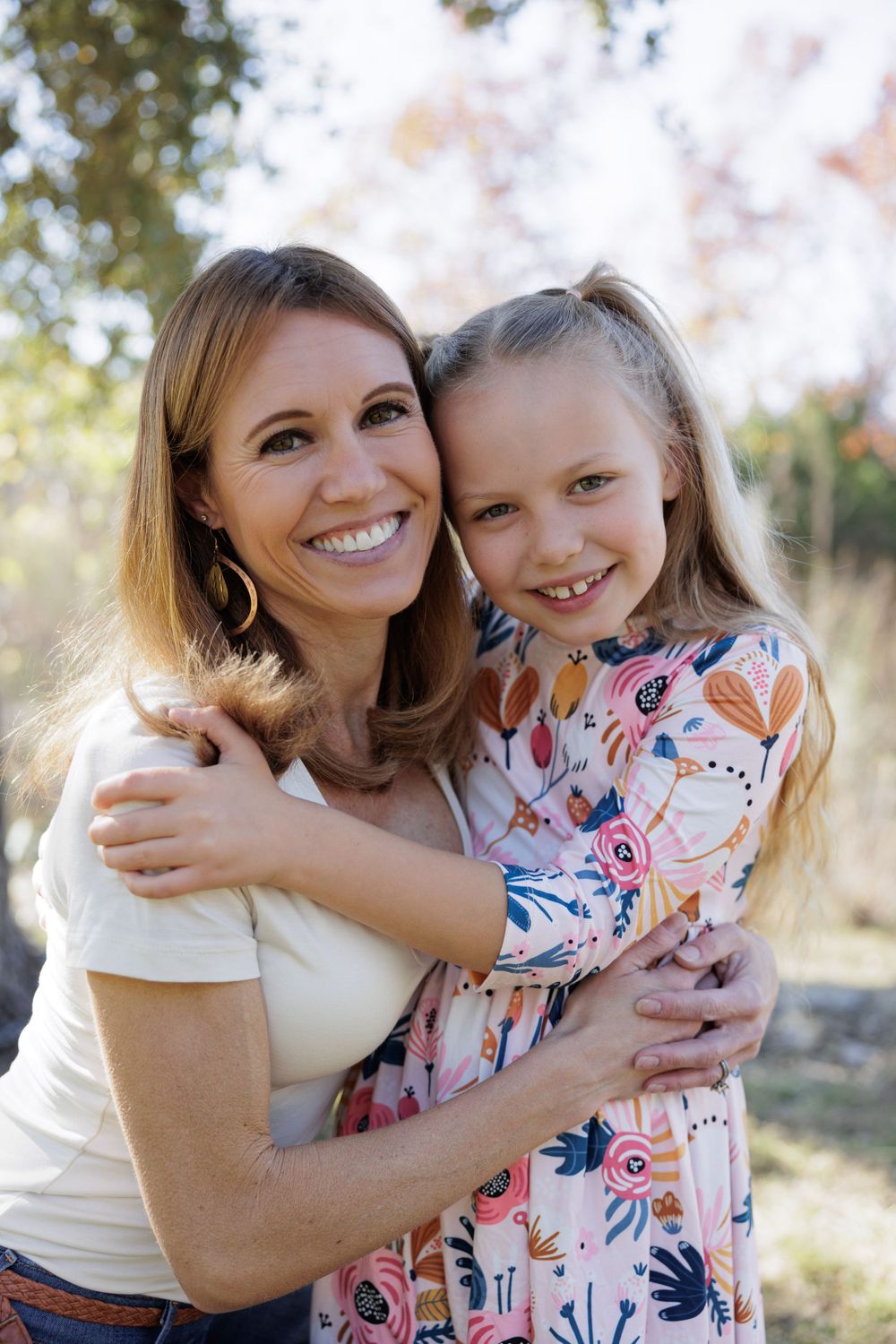Heartwarming outdoor portrait showing joy and connection in warm natural lighting.