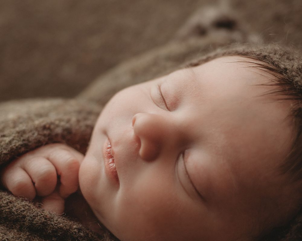 newborn baby mossy green swaddle