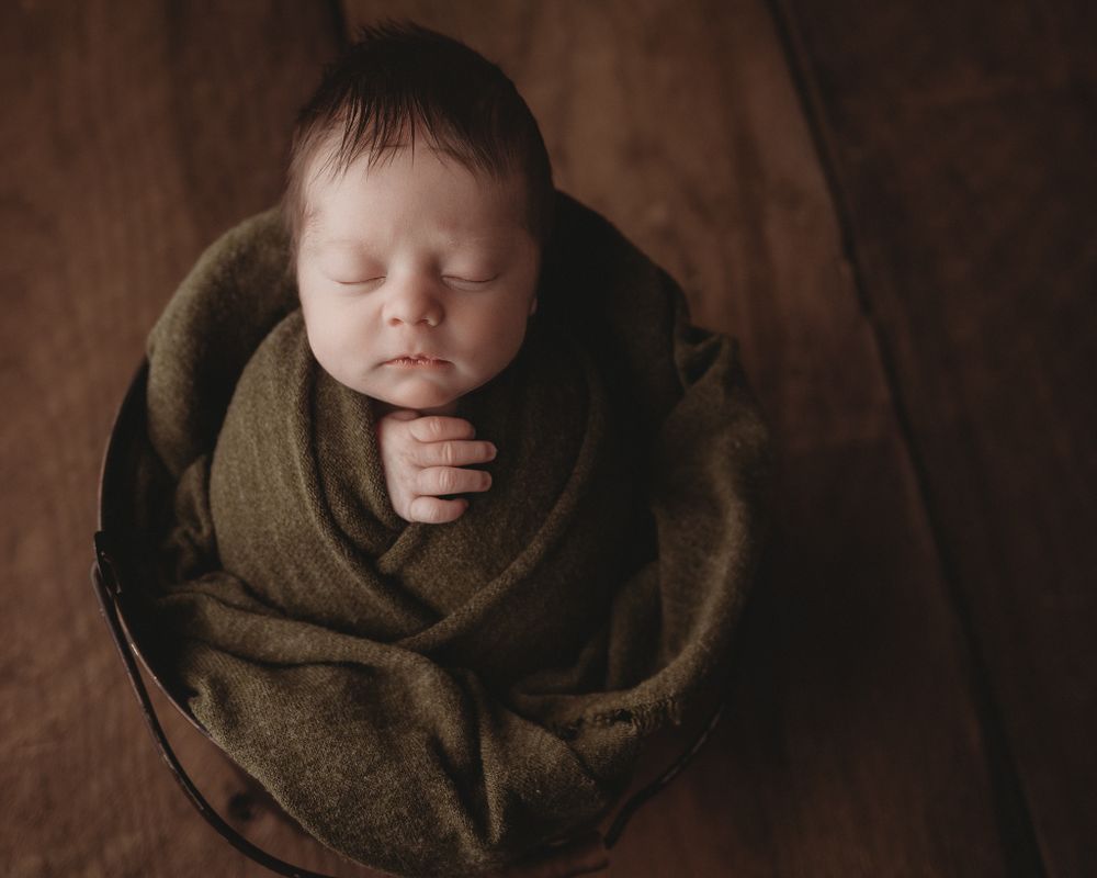 newborn baby mossy green swaddle