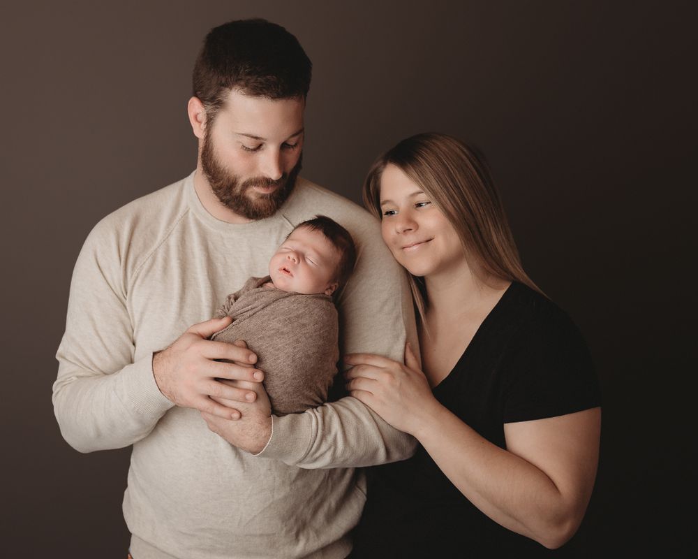 Professional newborn photo with mom and dad