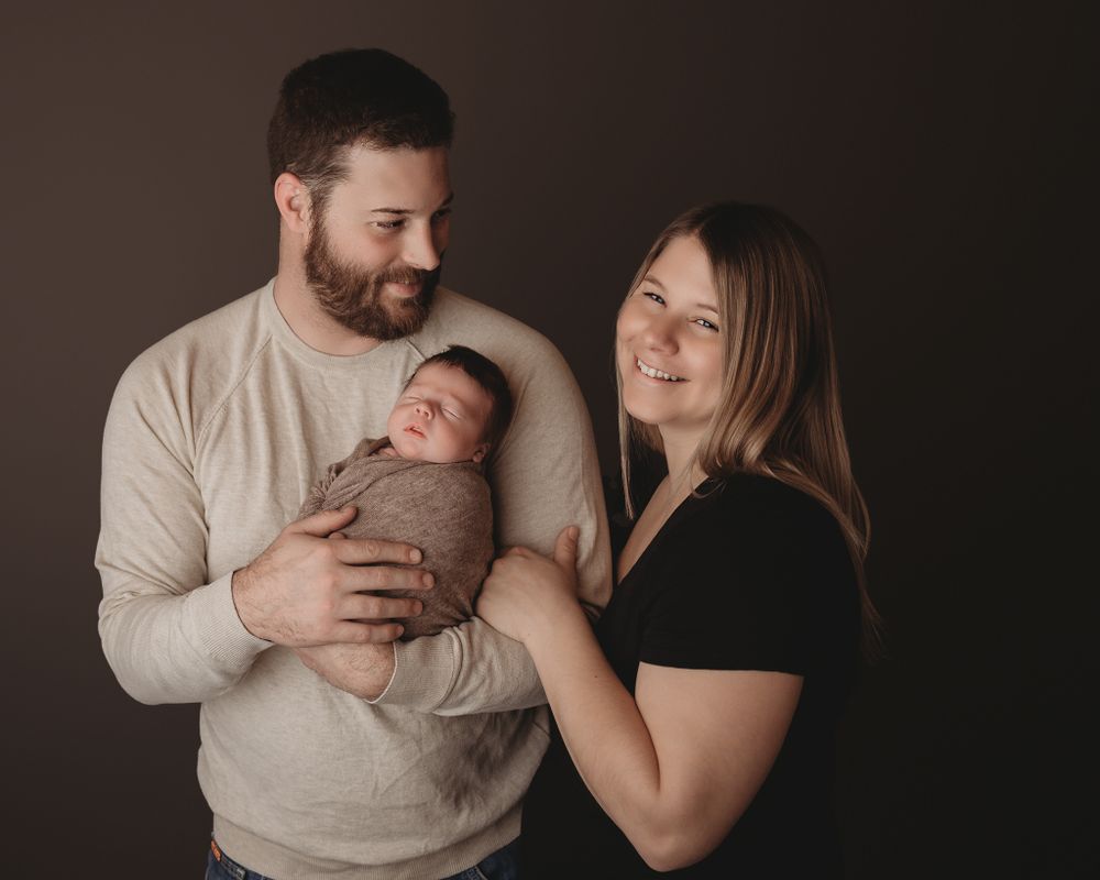 Professional newborn photo with mom and dad
