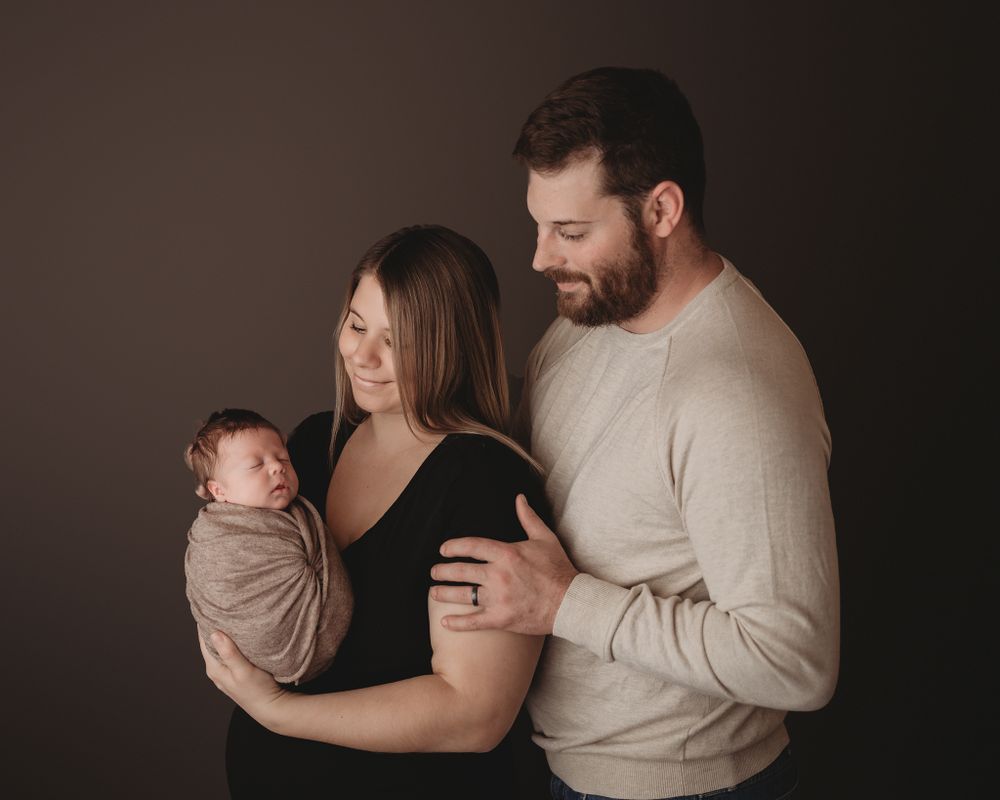 Professional newborn photo with mom and dad