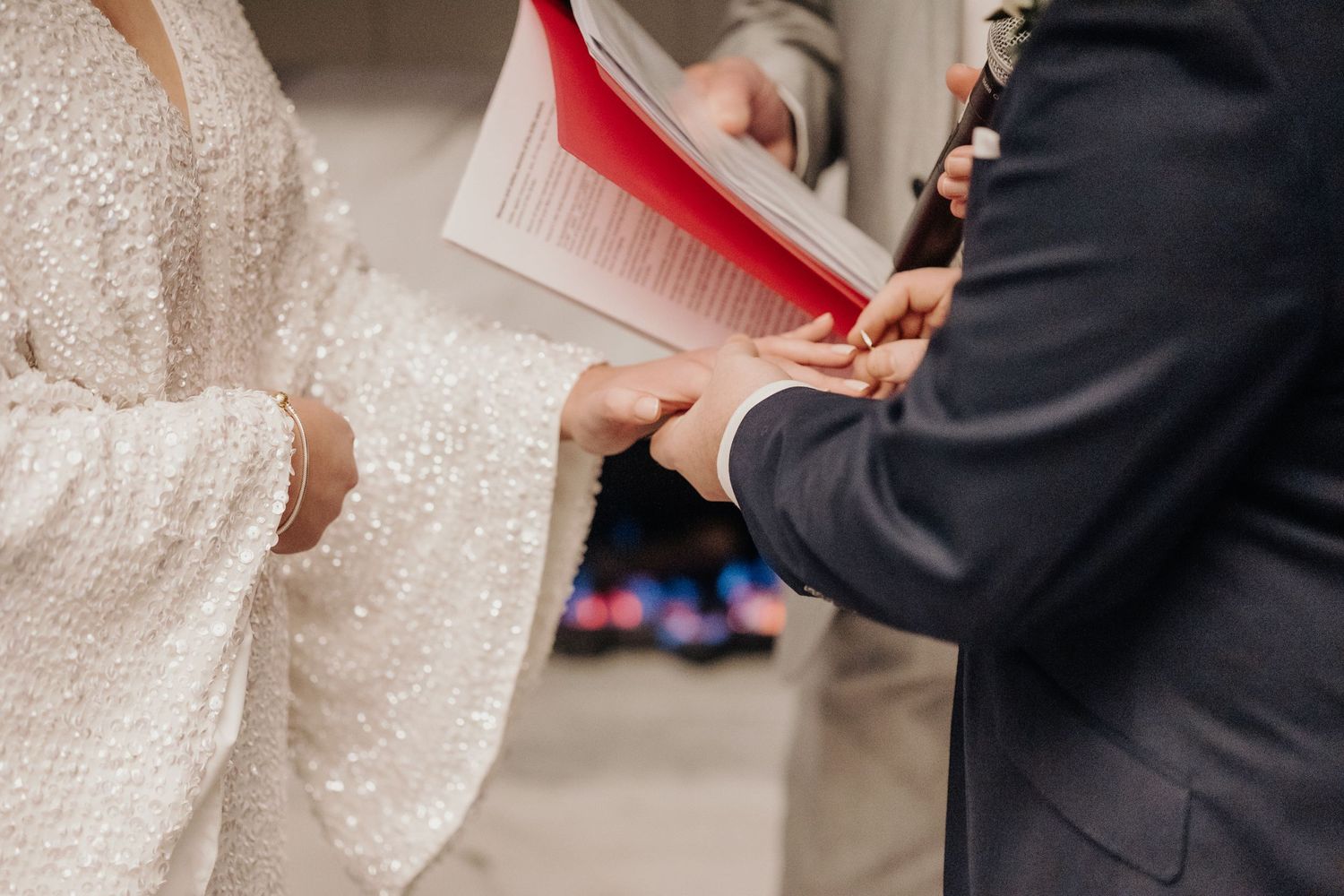 Close-up details of sparkling white wedding dress and formal attire.