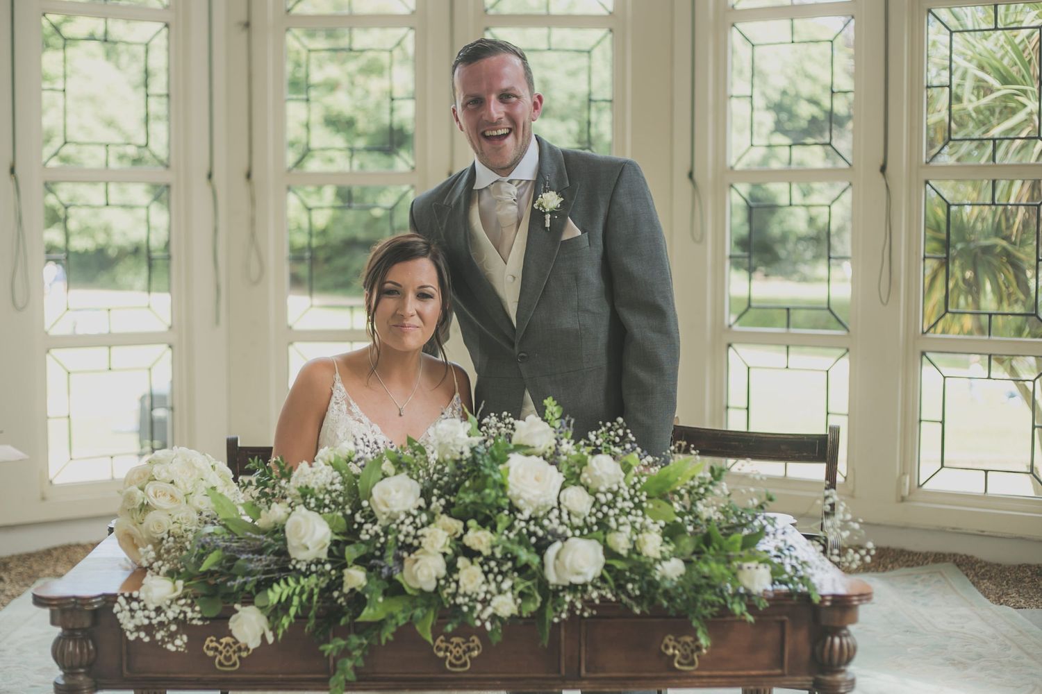Bride and Groom signing the wedding register at Highcliffe Castle