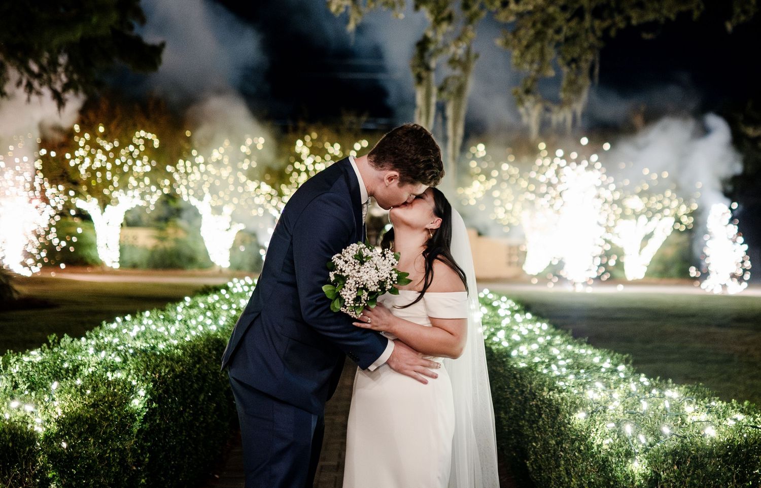 A couple kisses as fireworks go off behind them in New Orleans, Louisiana.