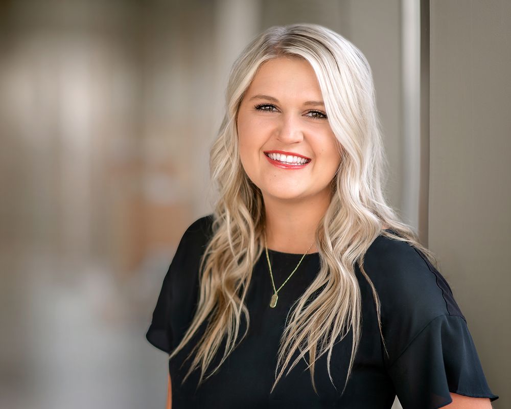 blonde woman wearing black smiling for headshot in richland wa