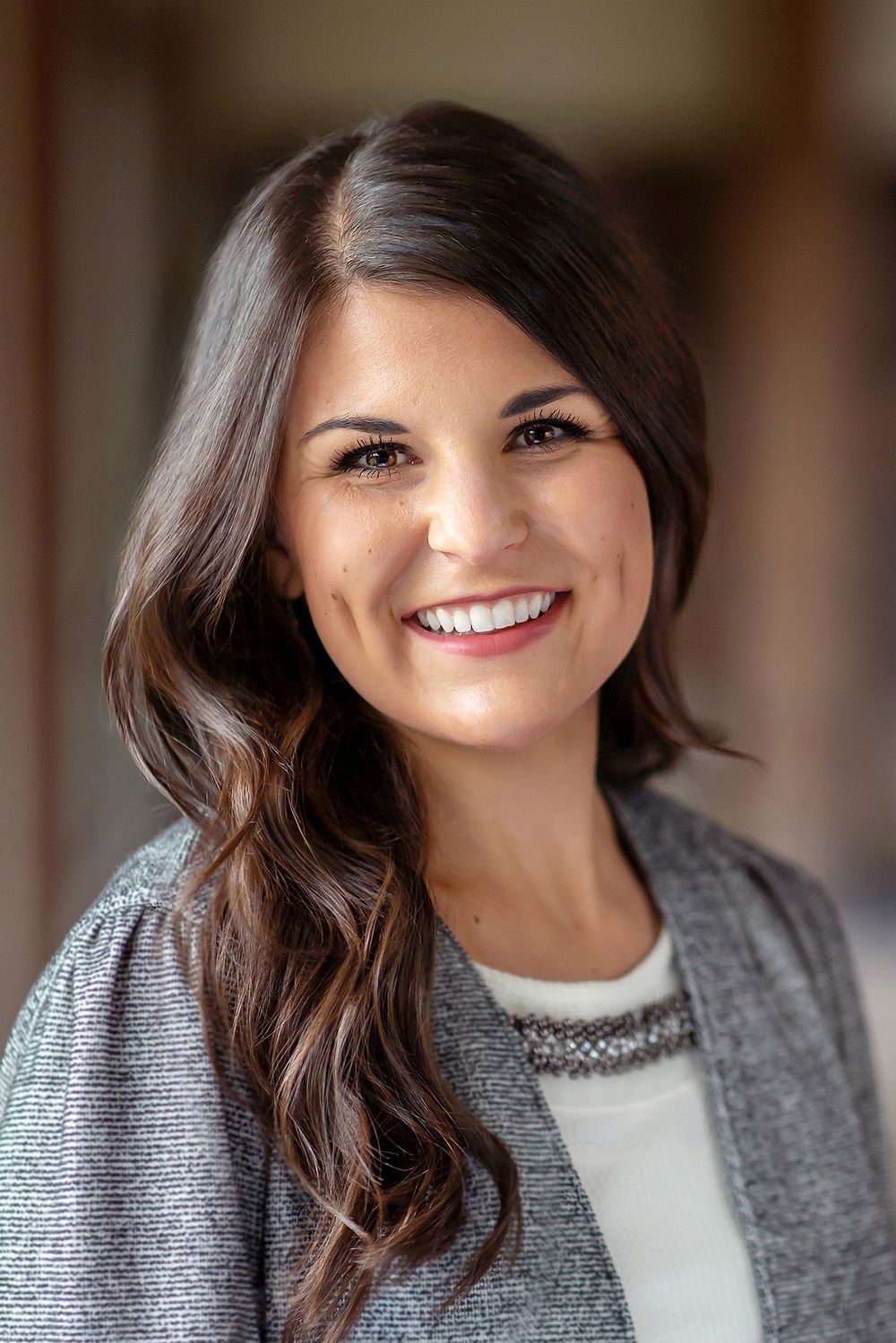 brunette woman wearing grey headshot with the tri cities headshot photographer