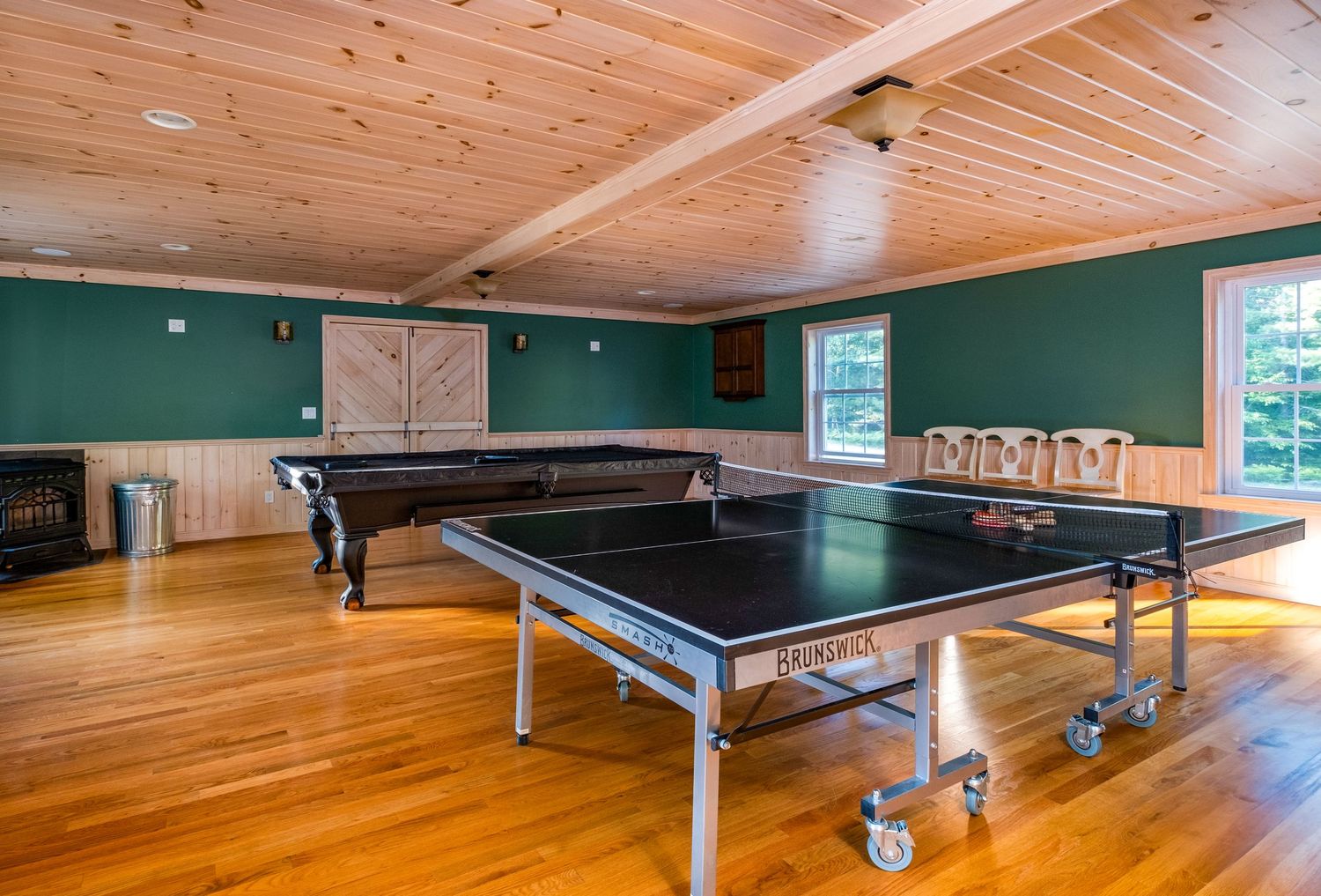 Game room complete with ping pong and billiards in Harrison, Maine.
