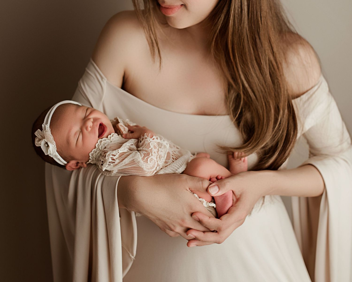 mom and baby pictures Riverside CA, mother in cream gown holding infant girl
