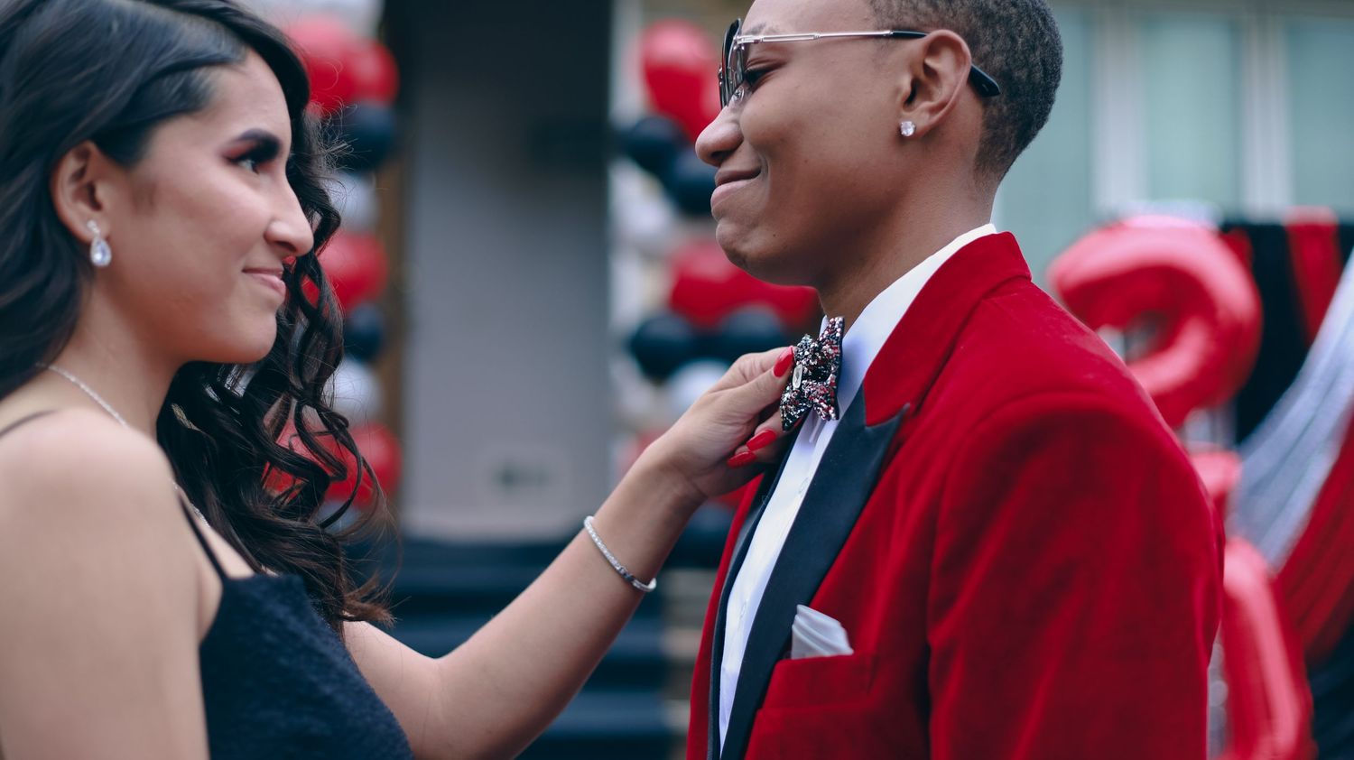 Picture of couple facing each other smiling.