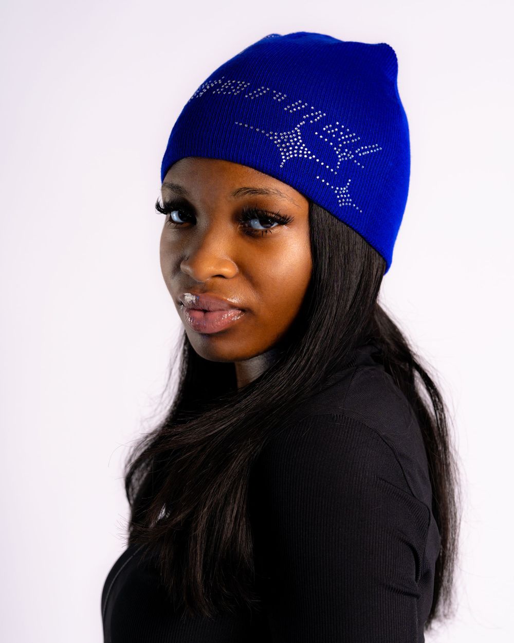 Studio portrait of model wearing blue beanie — fashion headwear photo by Timoy B Photography.
