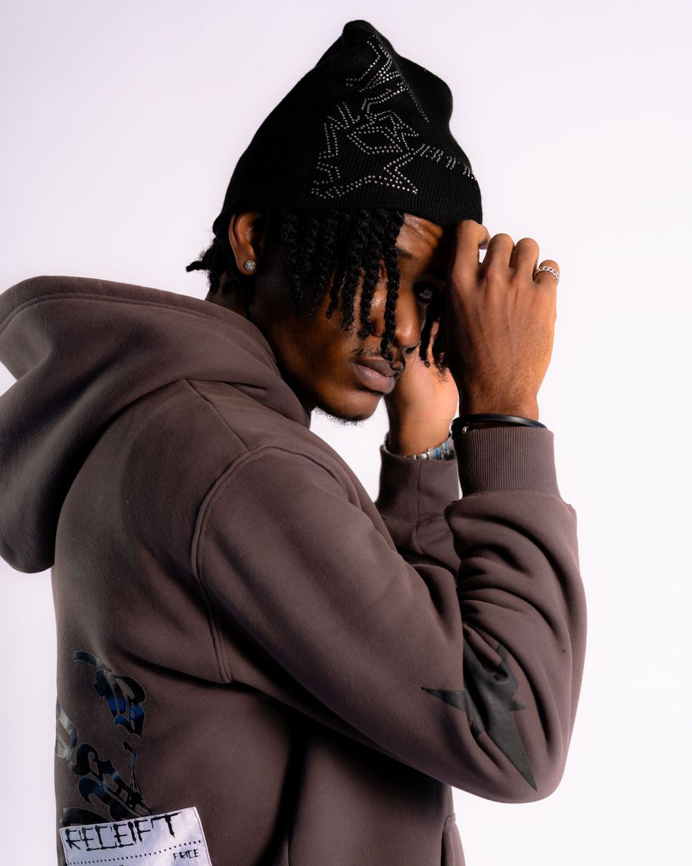 Studio portrait of model side view black beanie — product fashion by Timoy B Photography.