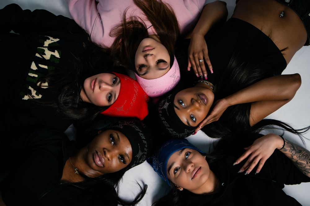 Studio portrait featuring a mix of beanie colors — creative fashion lighting by Timoy B Photography.