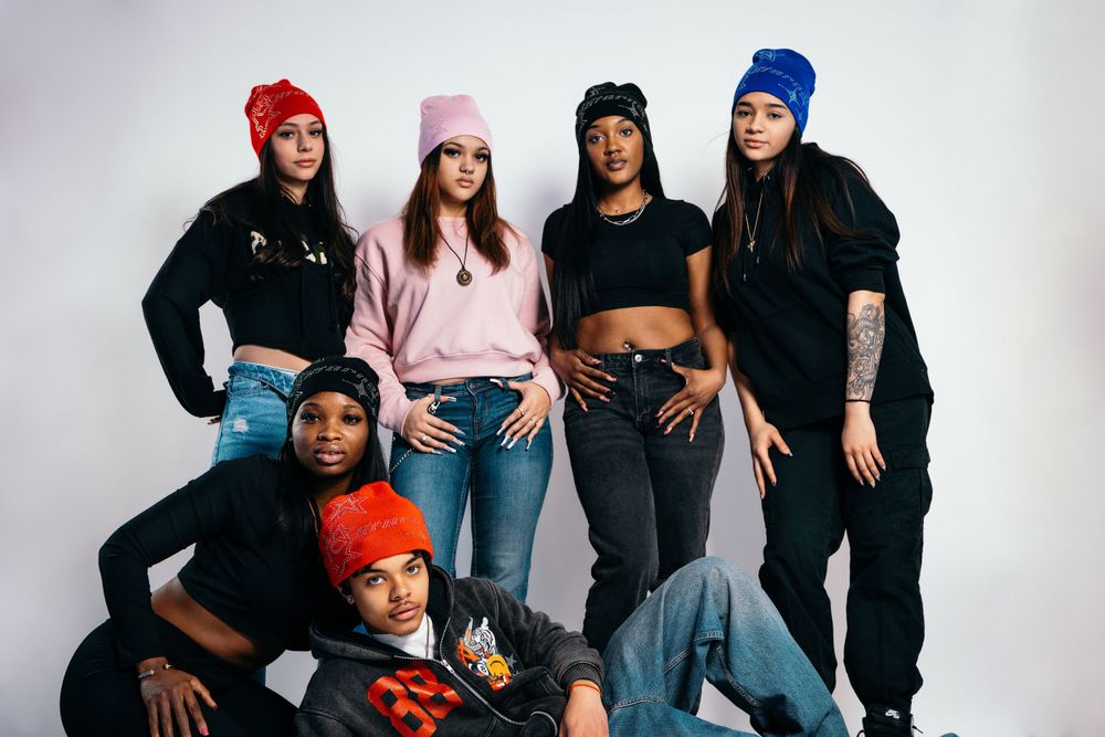 Group photo of models in colorful beanies — lifestyle campaign by Timoy B Photography.