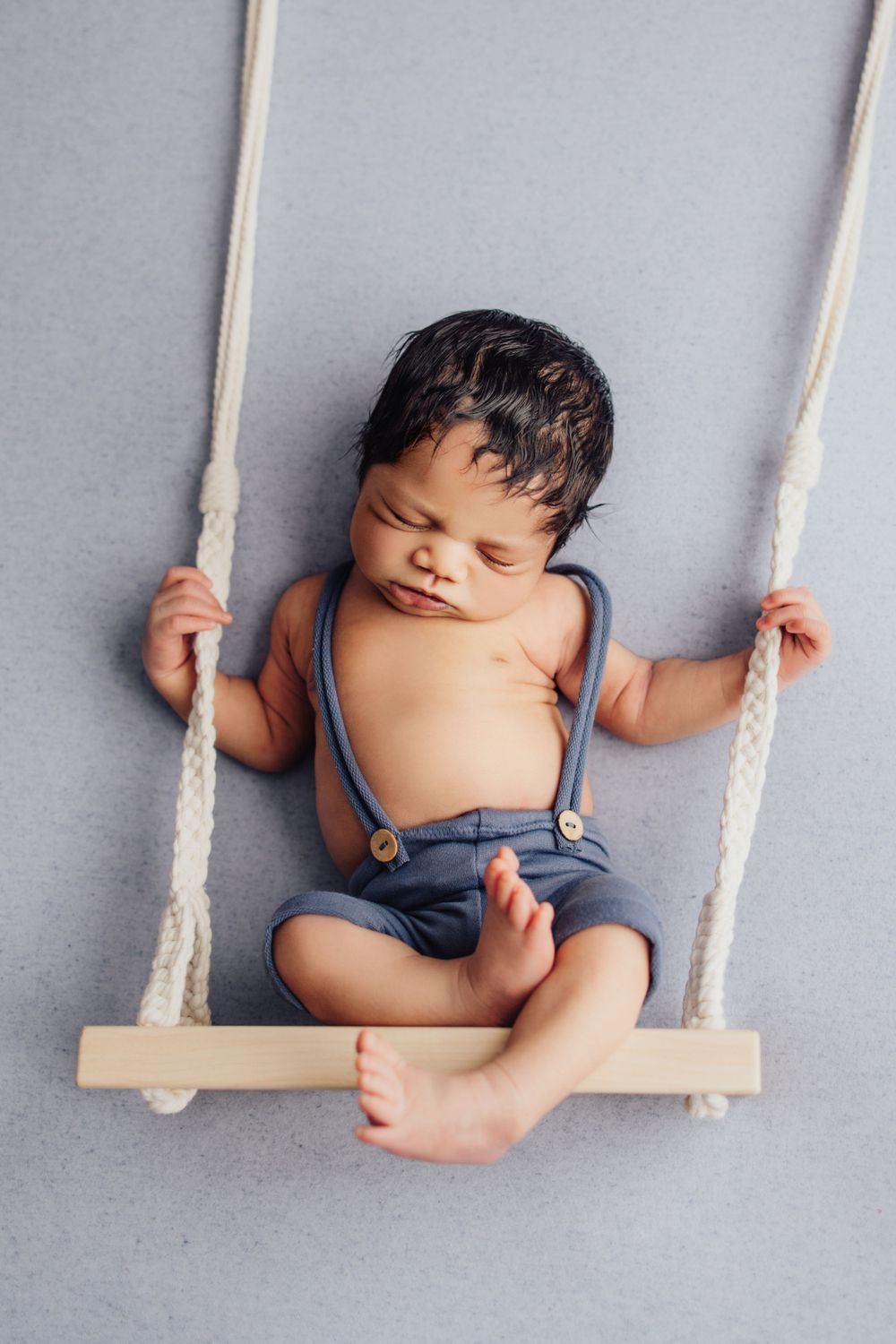newborn baby on swing Rachel Joan photography