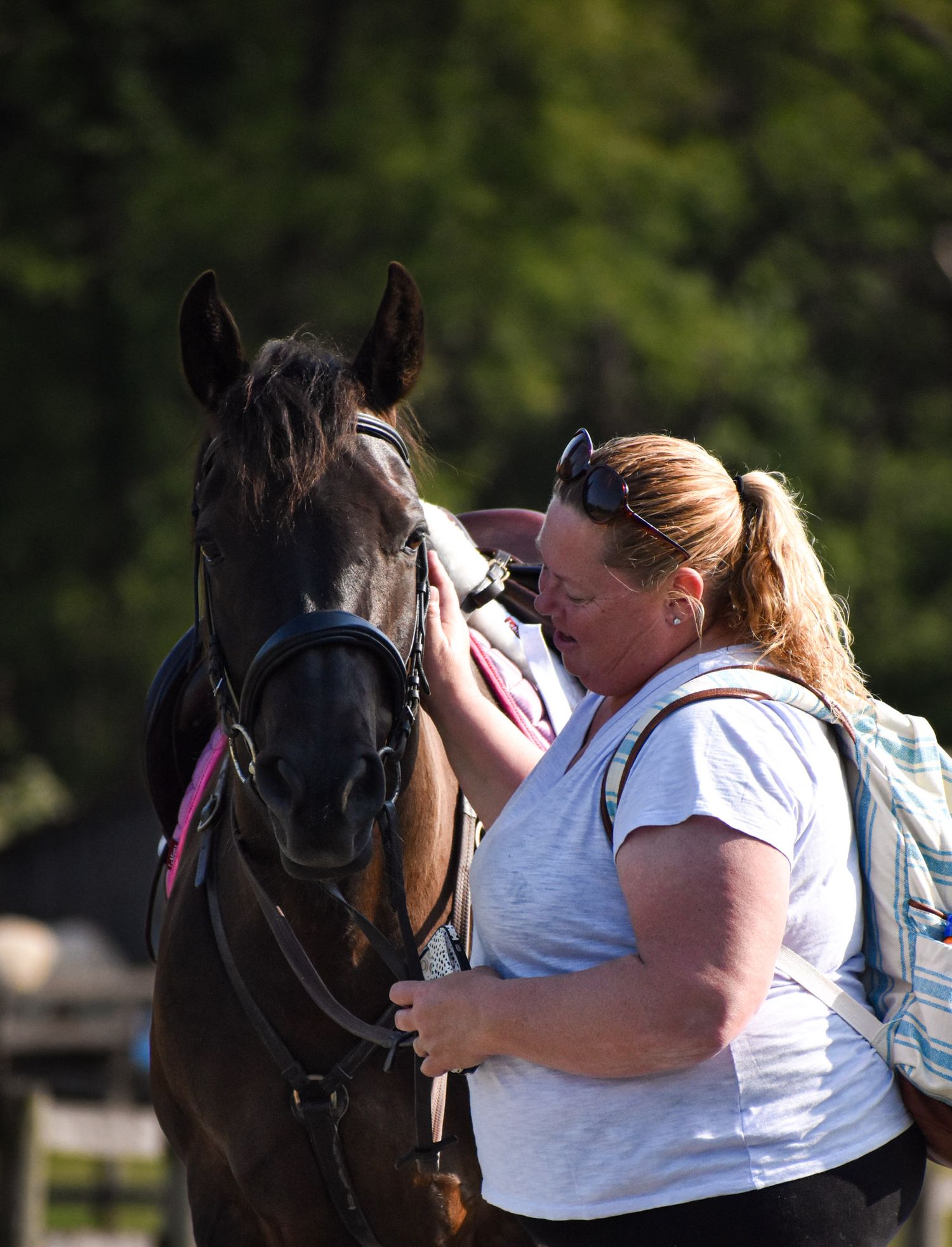 woman and black horse
