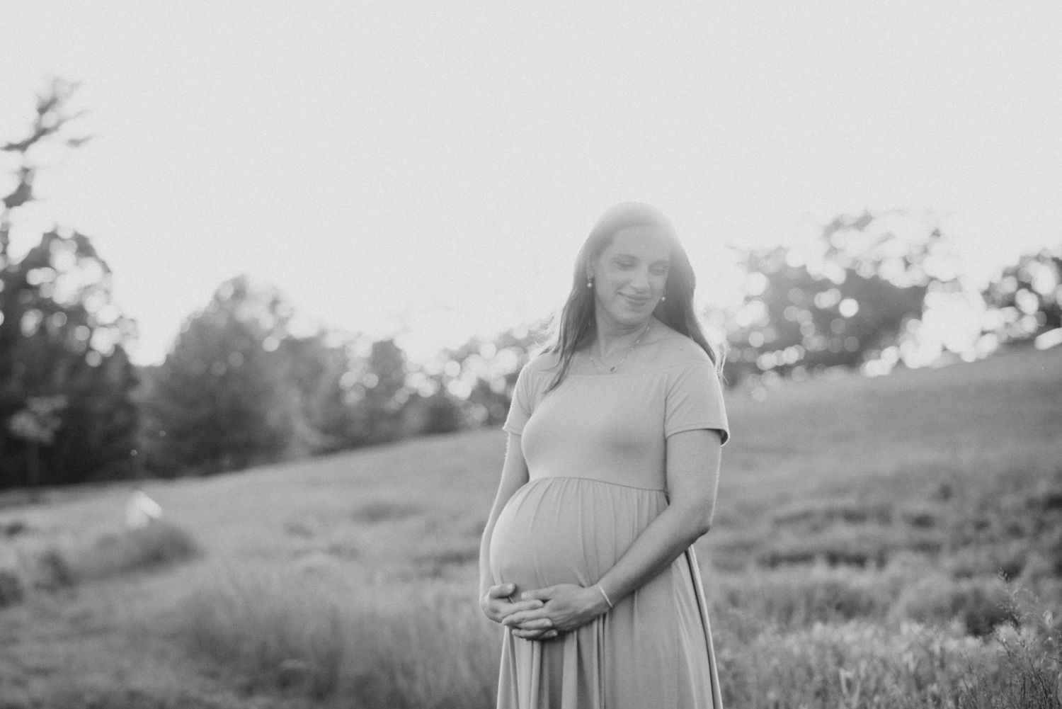 Mom to be peacefully closed eyes during maternity session film inspired