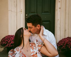 Bride and groom share a loving moment with a beautifully arranged bouquet in Union County, North Jersey