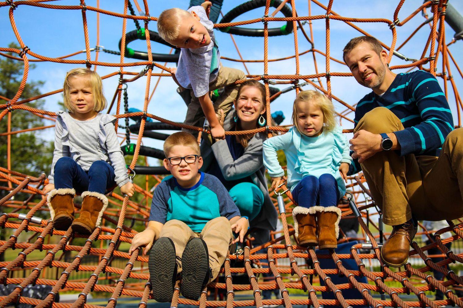 Family on a playground Cara Dawn Photography