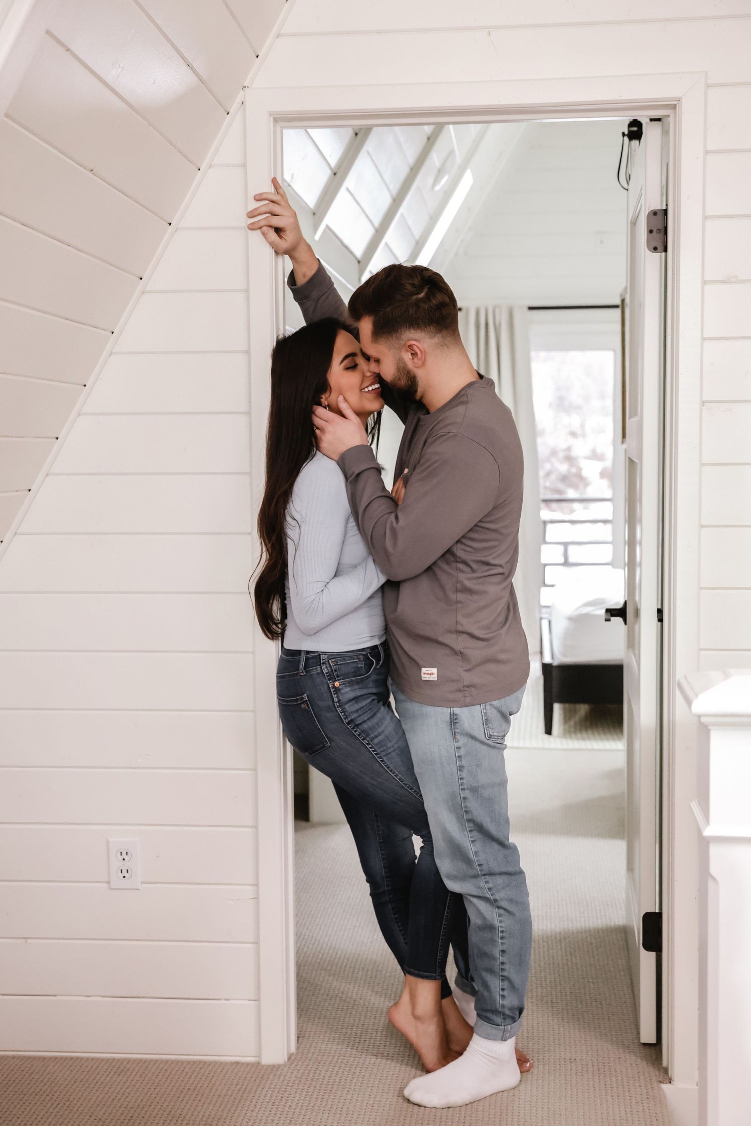romantic shot of a couple enjoying each other's company in a cozy Wyoming cabin setting