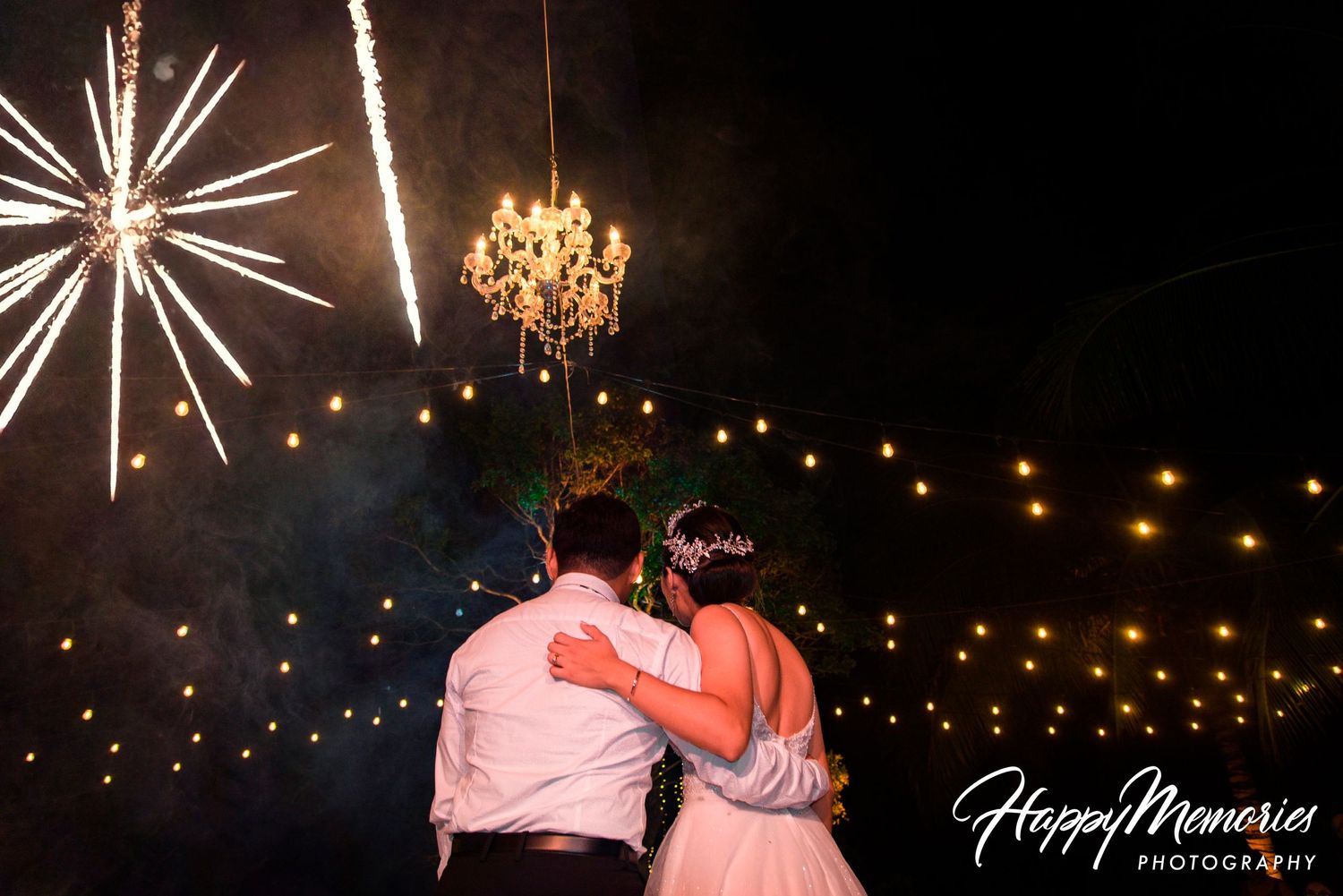 Spectacular fireworks display lighting up the night sky during wedding celebration.